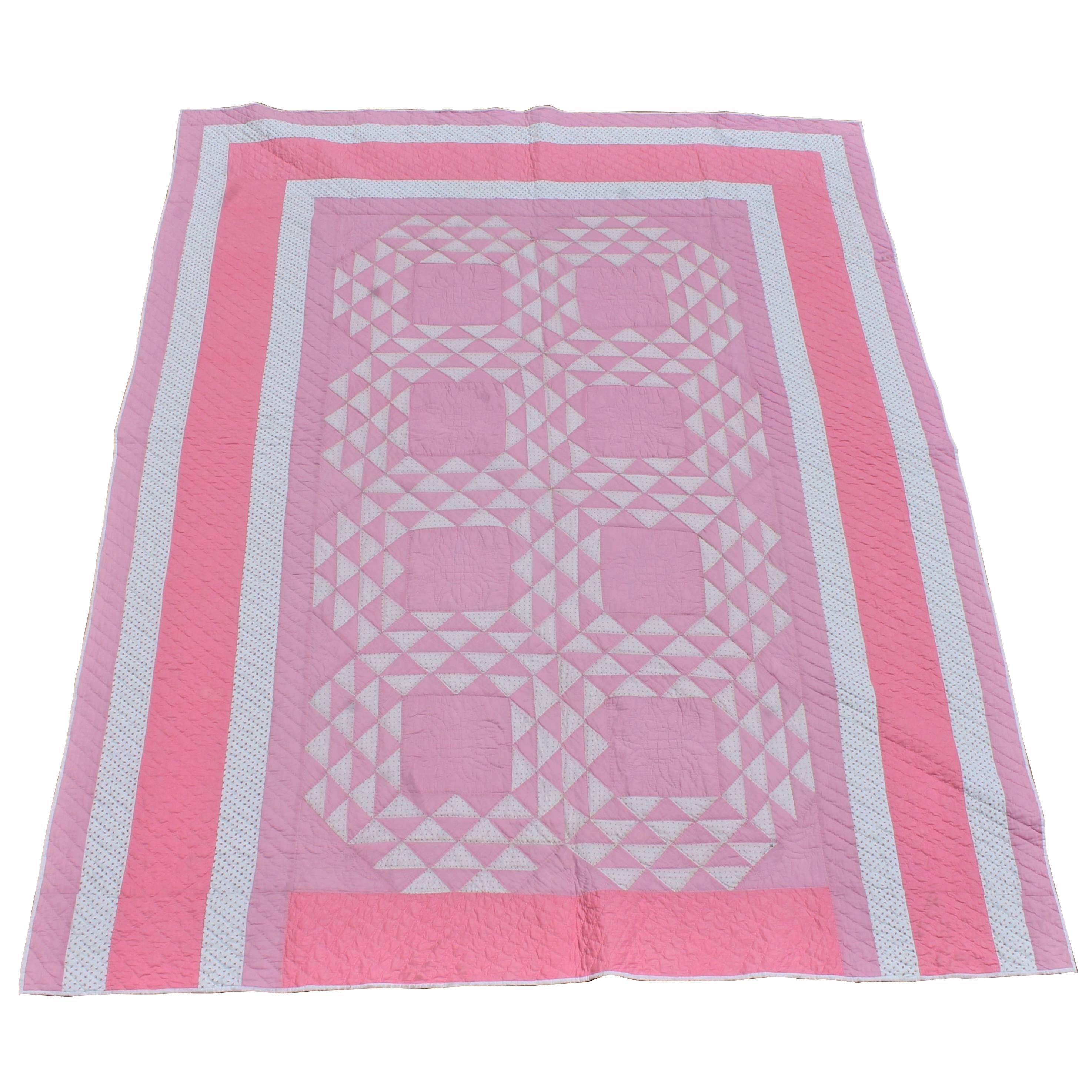 Pink and White Quilt in Contained Flying Geese Pattern