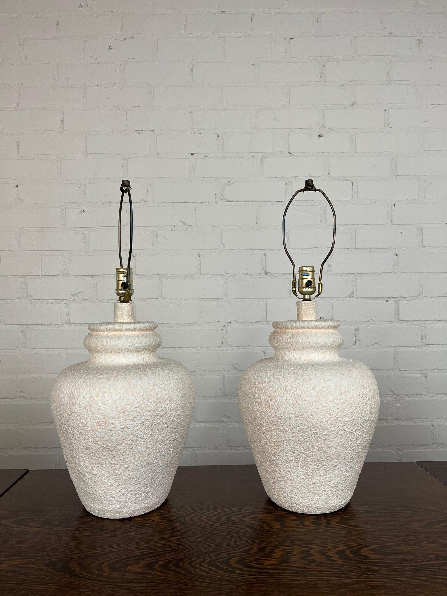 Measures : W11 D11 H25 base 6.

Price is for one, if you would like the pair add both to cart.

Vintage table lamp circa 1980s make in ceramic with a speckled plaster finish. The lamp is a light pink with speckled white over top. Table lamps has