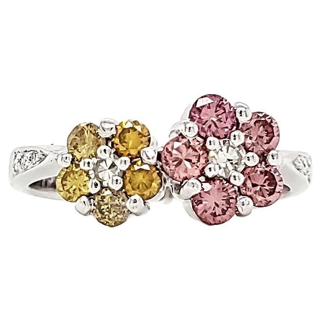 Pink and Yellow diamond flower motif ring. Valentines or otherwise.

A two color flower design brings out the beauty of this ring as the colors of Yellow and Pink  complement each other.

The 5 pink diamonds weigh 0.45 cts and have an strong and