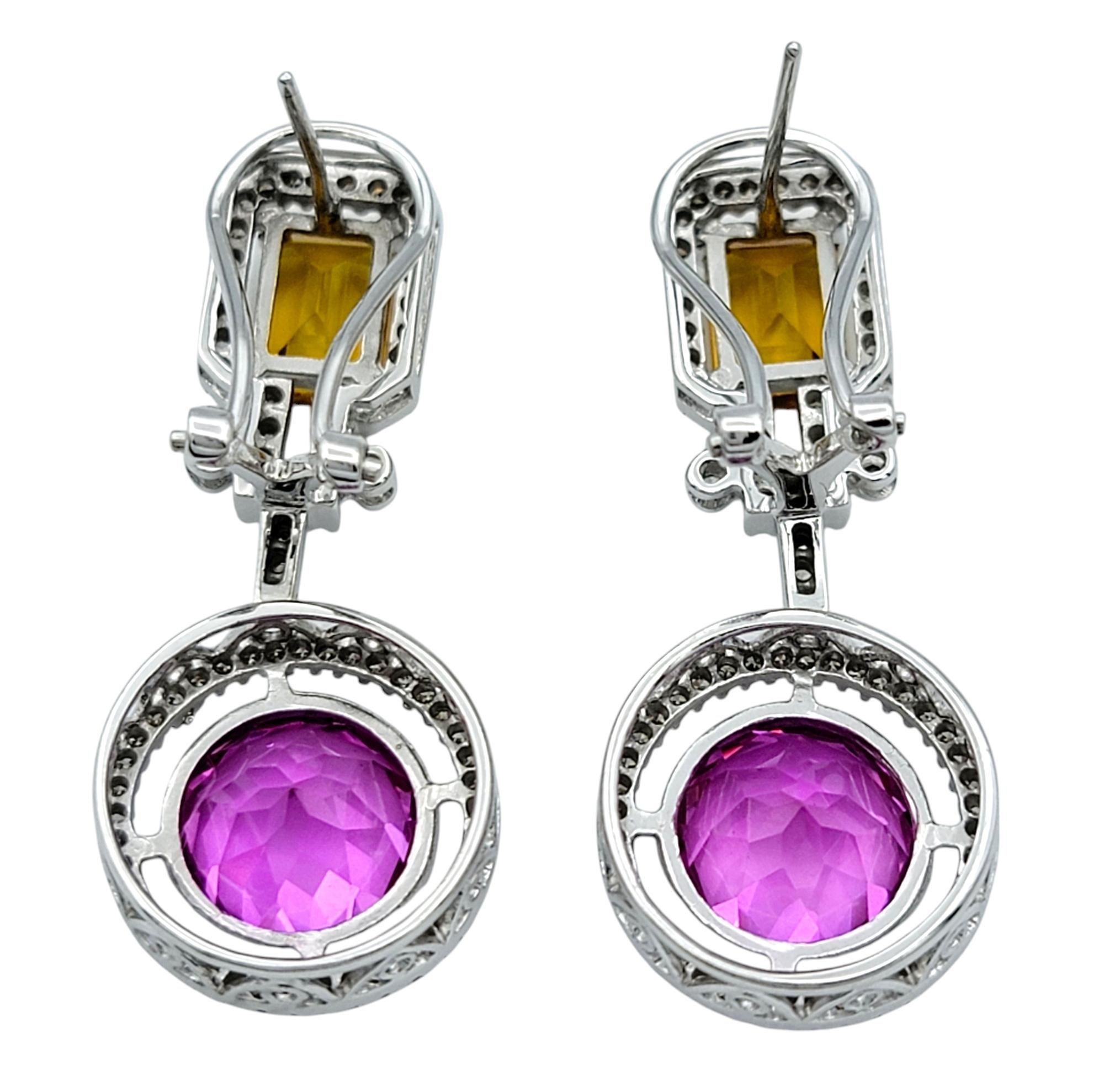 These exquisite earrings feature vibrant lab-grown pink and yellow sapphires set in a contemporary and elegant design. The center colored stones showcase a striking combination of round and emerald cuts, with the lab-grown sapphires totaling