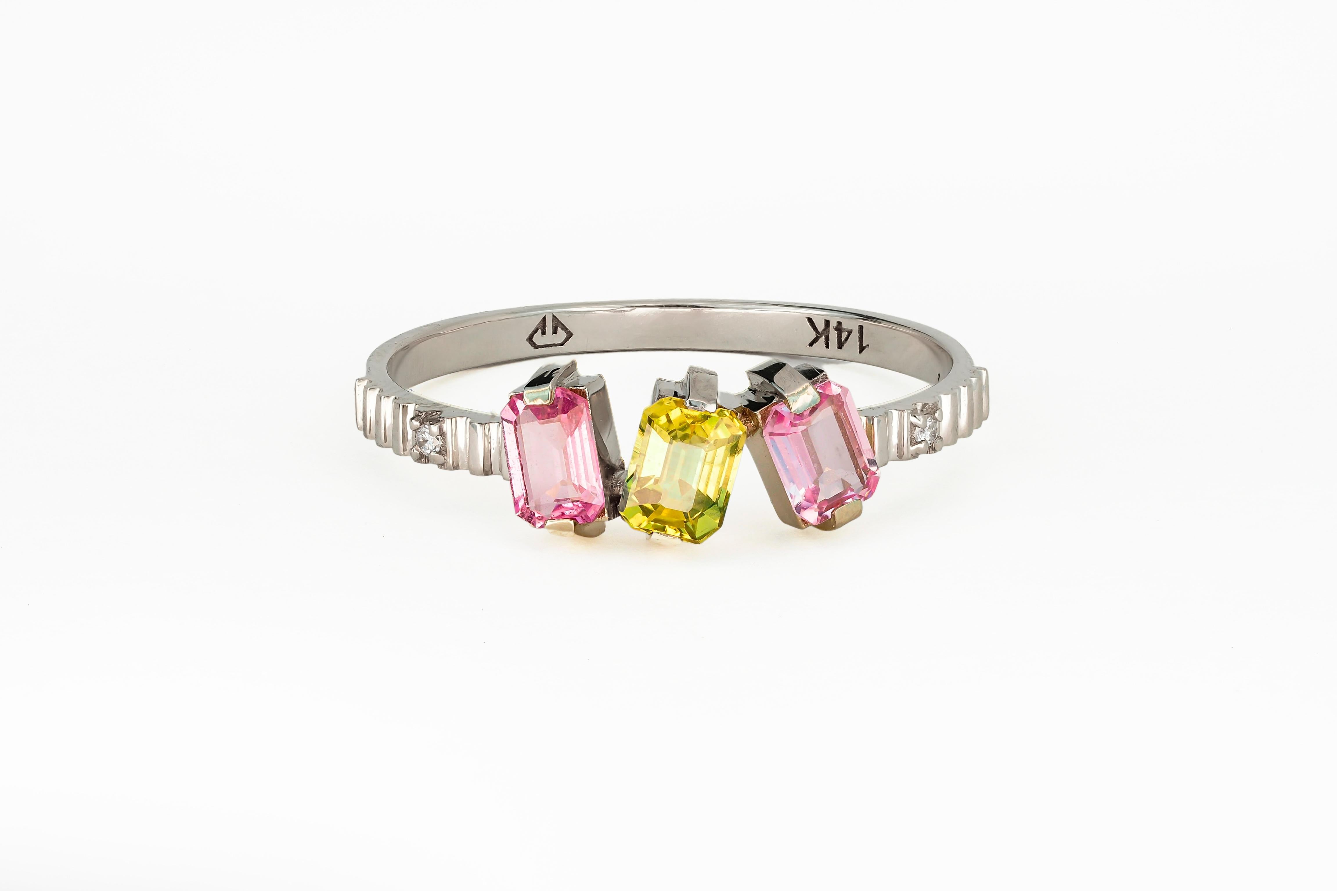 Pink and yellow sapphire gold ring. 

Baguette sapphires and diamonds ring
Weight: 1.65 g. depends from size.
Metal: 14 karat gold

Central stone: Sapphires - 3 pieces
Cut: Baguette 
Weight: aprx 0.45 ct (3x0.15ct)
Color: pink  and yellow
Clarity: