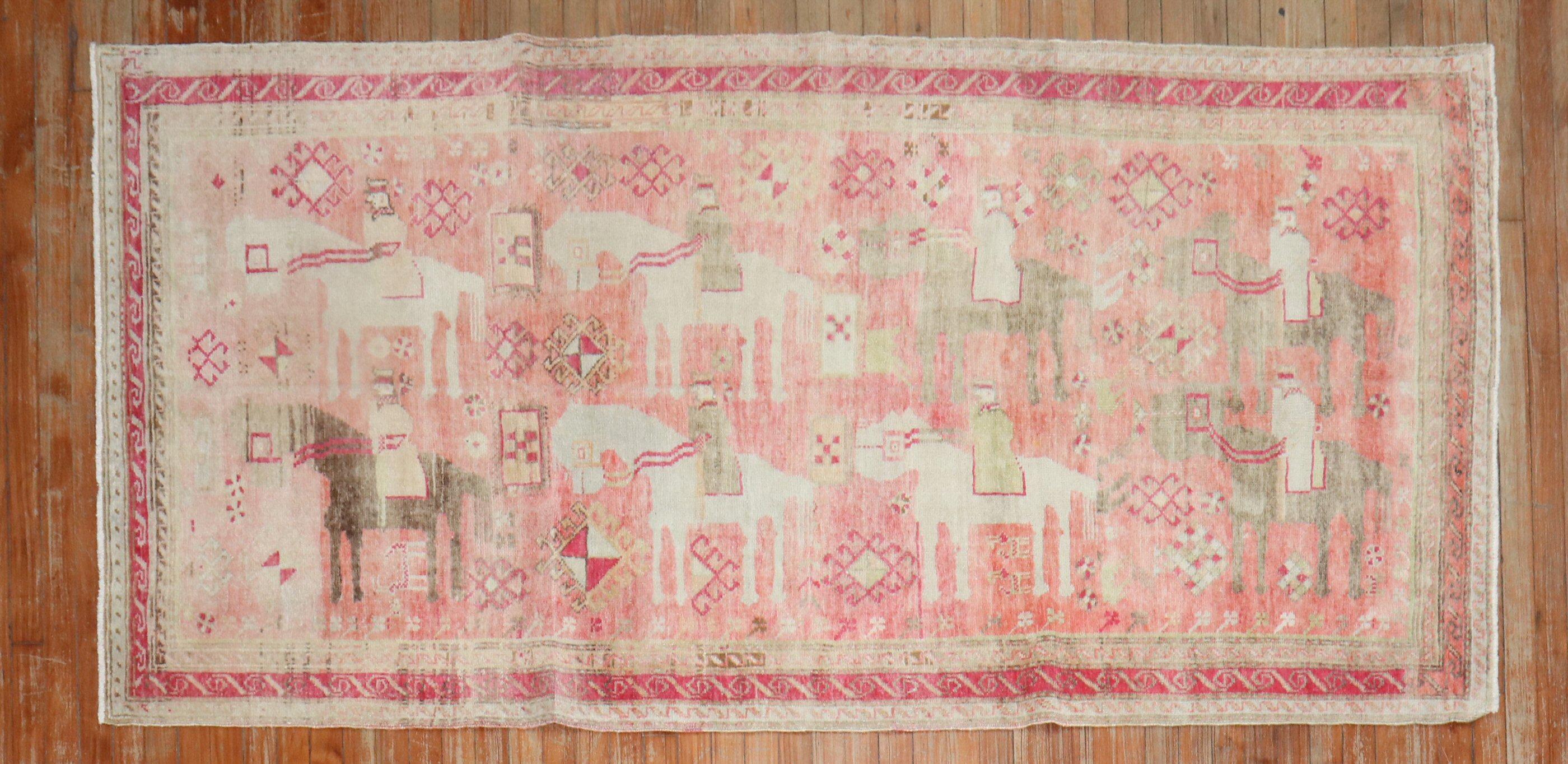A russian Karabagh from the 2nd quarter of the 20th century with a pictorial caravan motif in pink

Measures: 3'10'' x 8'2''.