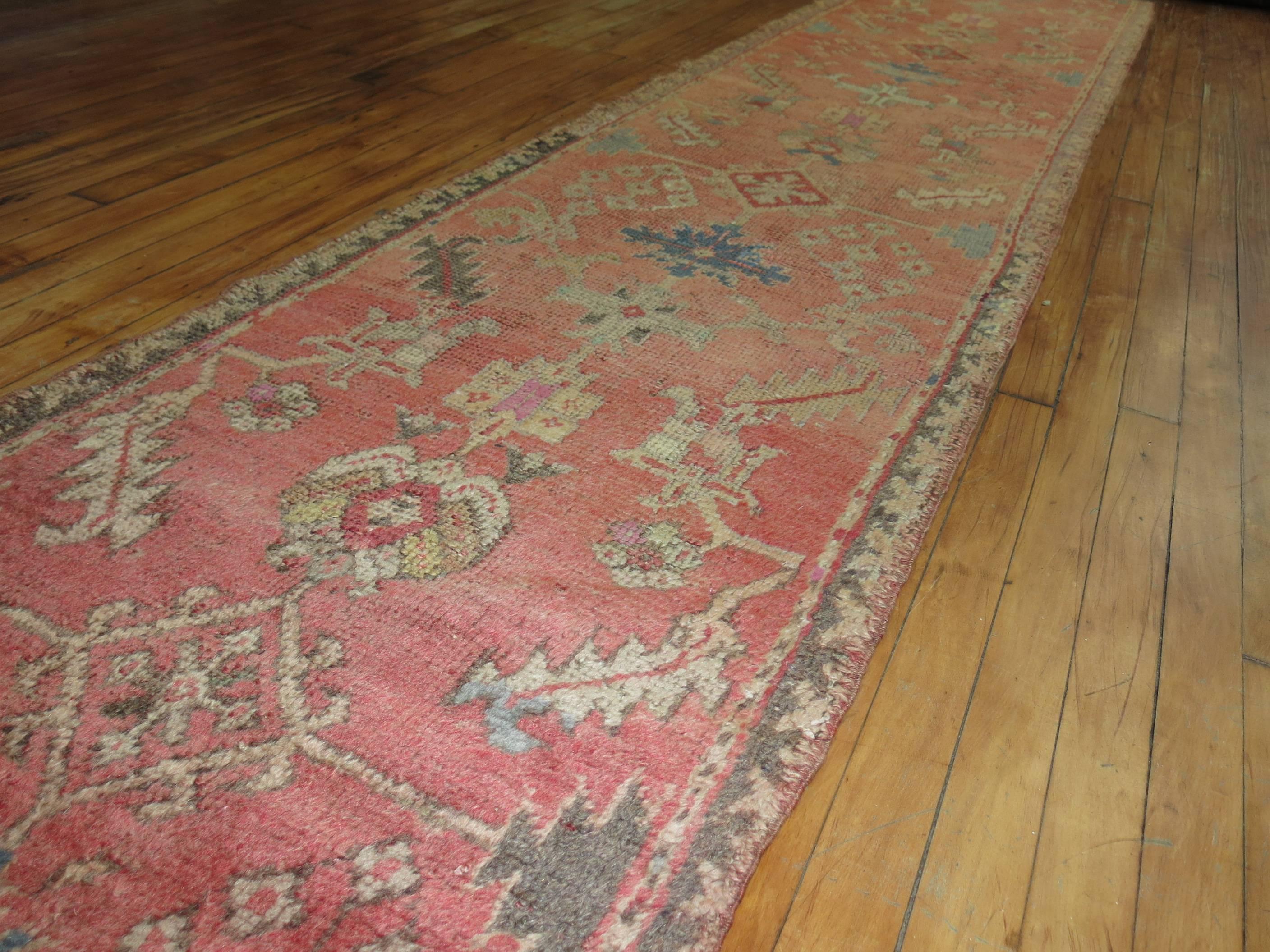 Early 20th Century Pink Antique Turkish Oushak Runner For Sale