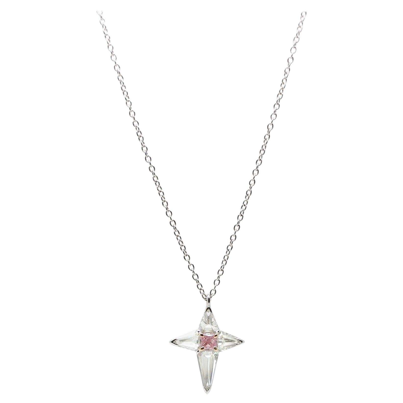 An elegant and sophisticated Cross Pendant Necklace composed by 1 Argyle Pink Natural Colour Radiant Diamond of 0.22 Carat in the centre,  and 4 White Kyte Cut Diamonds of 0.86 Carat to form the Cross. The White Kyte Diamonds are set upsidedown to