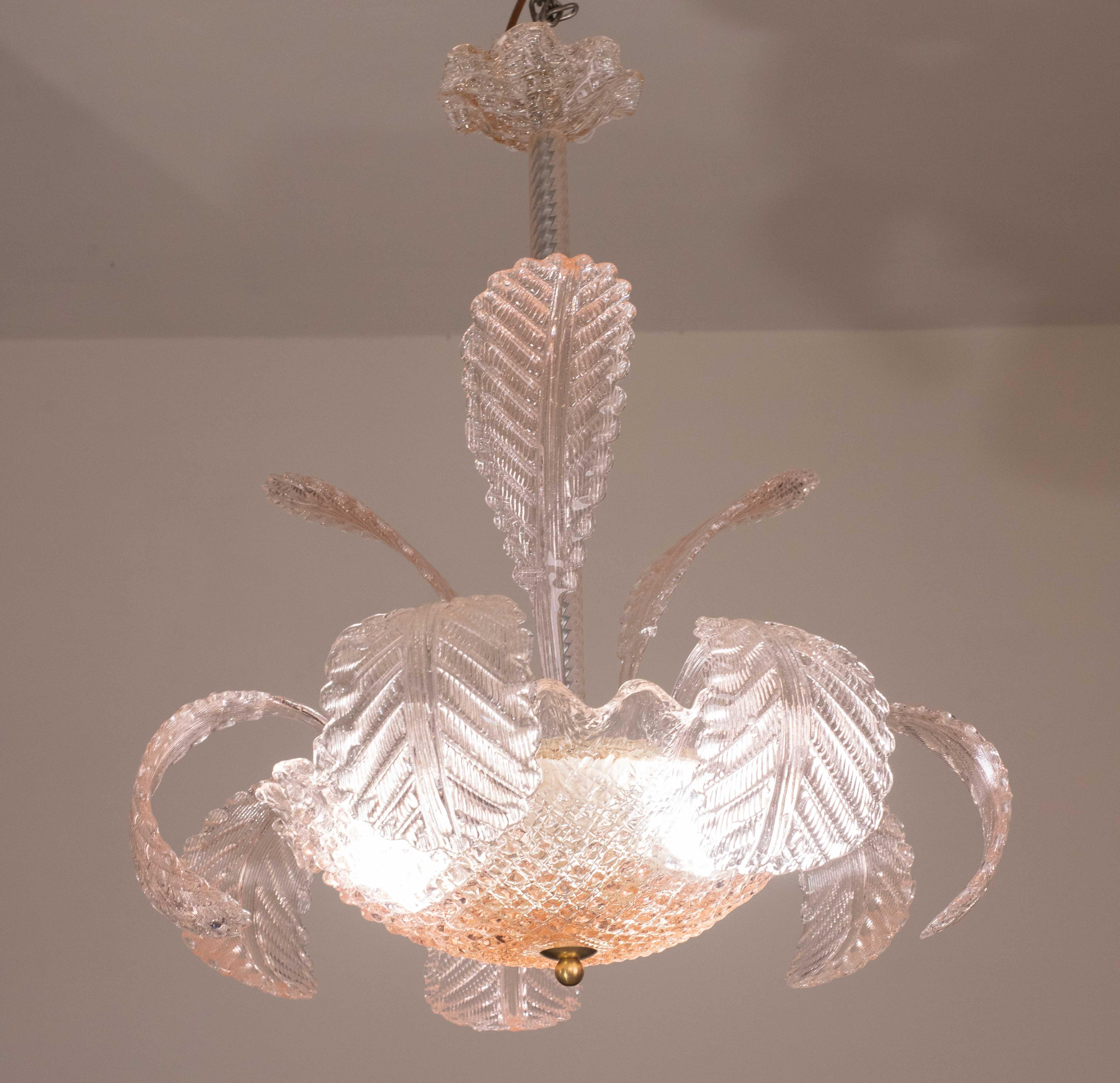 Wonderful Murano chandelier made by Barovier and Toso glassworks.

Design period: 1930s\1950s.

The chandelier consists of 7 low leaves and 6 tall glass elements.

The height measures 75 centimeters, the diameter 60 centimeters.

Possible to rewire