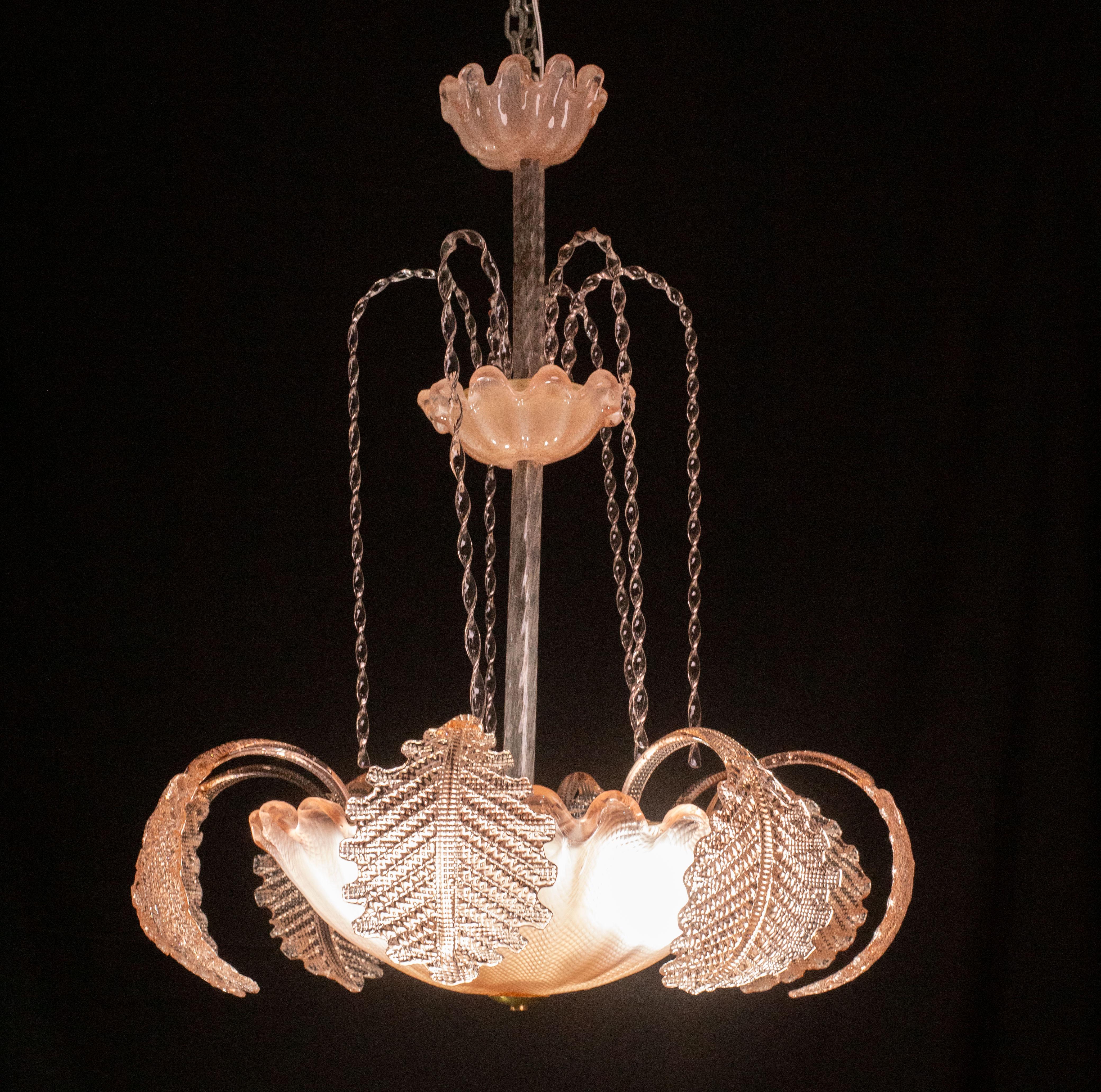 Wonderful Murano chandelier made by Barovier and Toso glassworks.

Design period: 1930s\1950s.

The chandelier consists of 8 low leaves and 6 tall glass elements cascading down, a beautiful work of glass craftsmanship.

The height measures 80