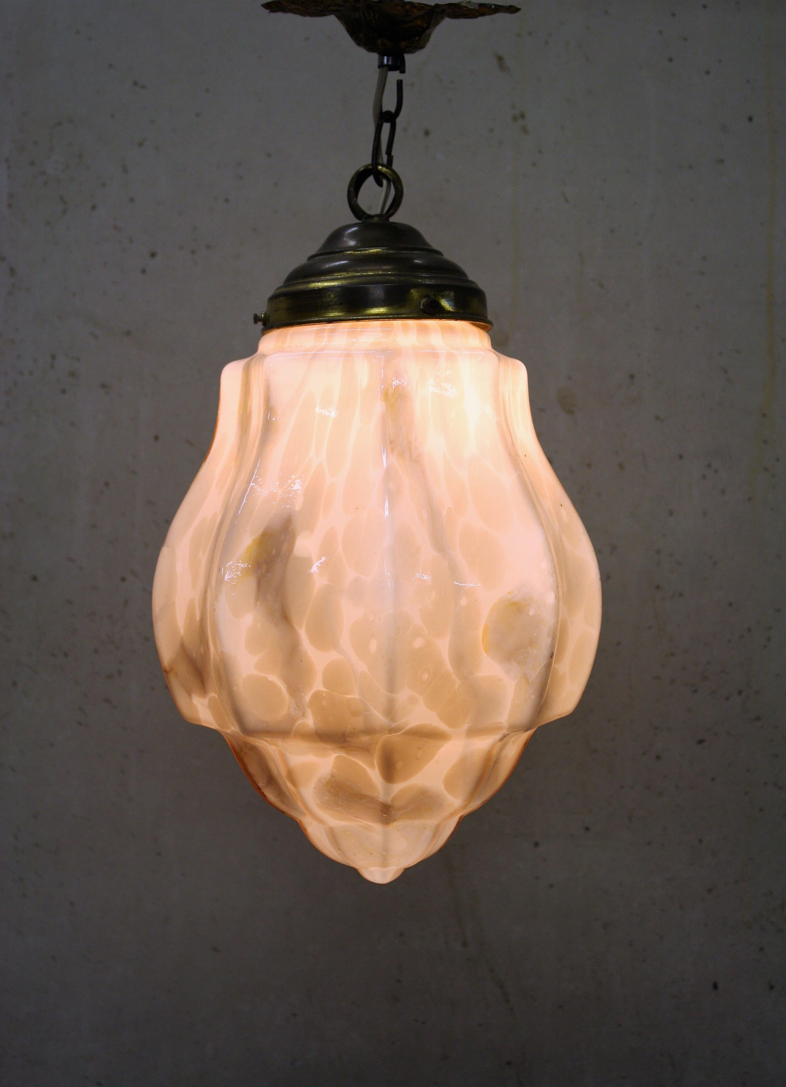 Pink Art Deco pendant light with marbled glass, 1930s

Description:
 
Charming pink marbled glass Art Deco hallway light. 

The lamp emits a warm light.

Original copper shade holder and canopy. 

Tested and ready for use.

1930s,