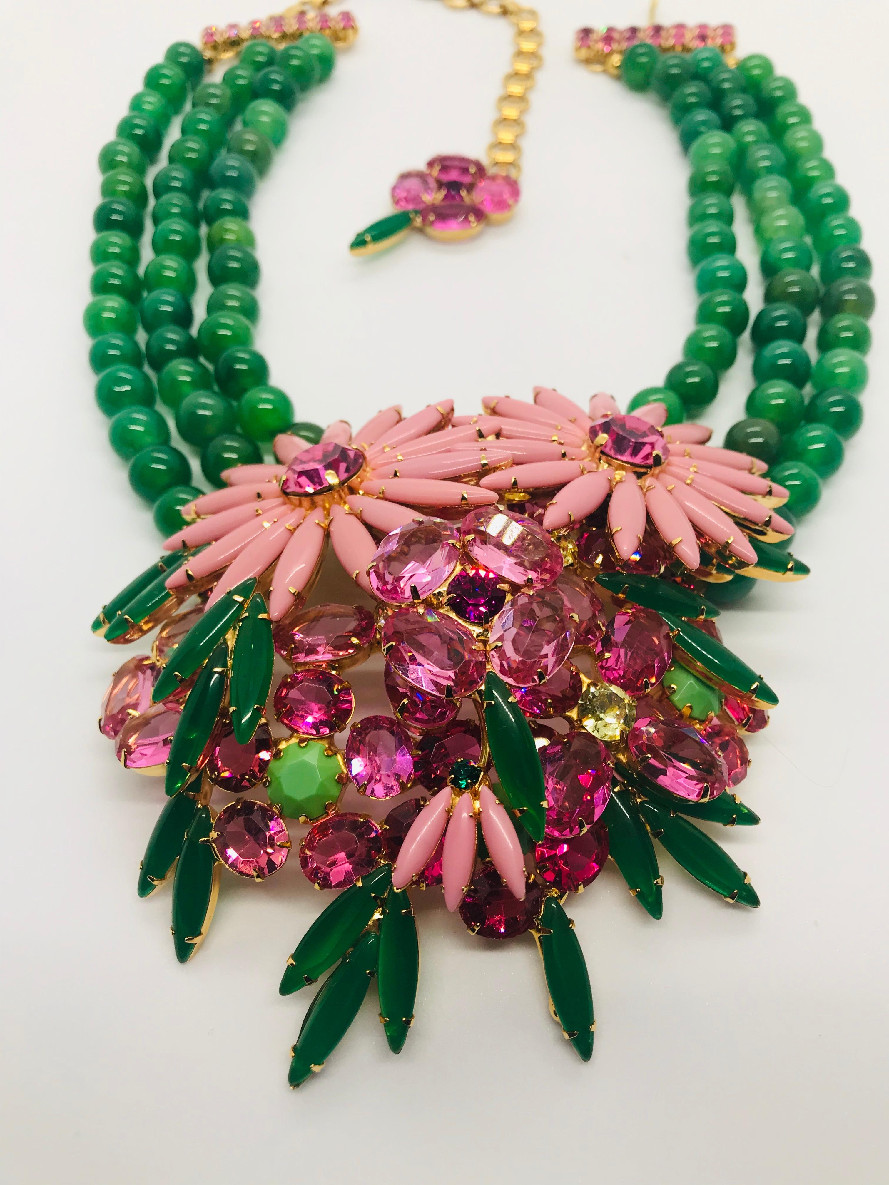 One of the most exciting necklaces we have created is our multi pink Austrian crystal floral cluster necklace, featuring beautiful semi-precious green fire agate beads.  The three dimensional floral cluster at the center of this necklace features