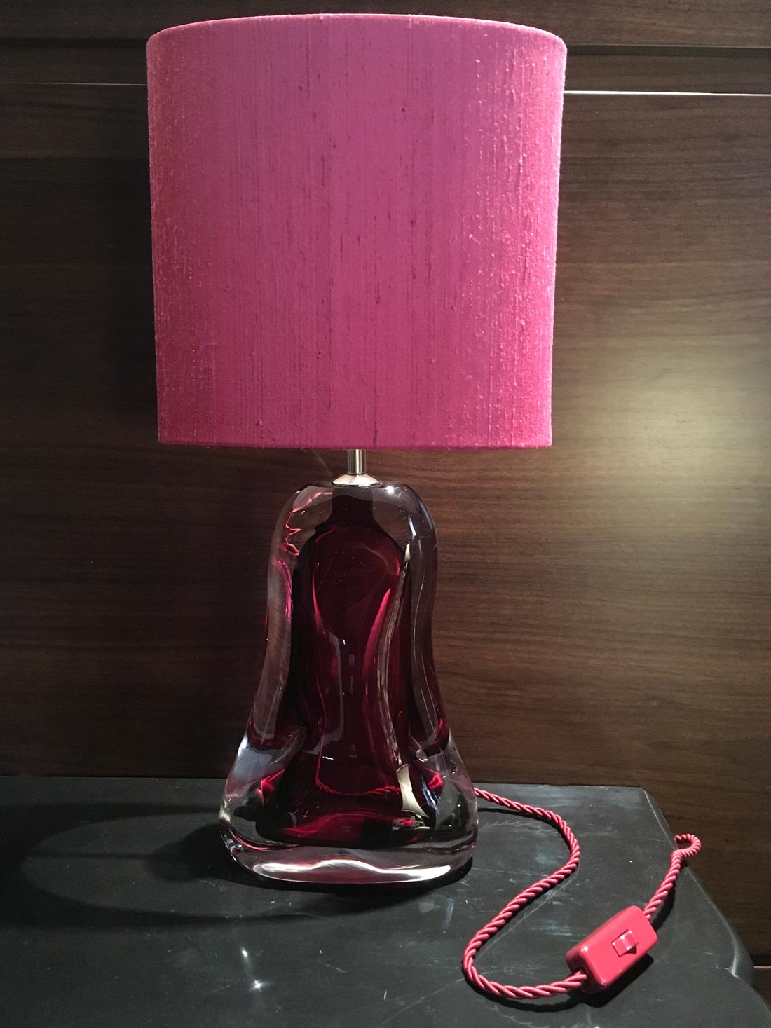 Contemporary fuchsia blown glass table lamp with fuchsia silk lamp shade is a beautiful eye-catching object of art for the solid presence of the handcrafted glass.
Made by Porta Romana, United Kingdom
220-240 V max wattage 40W
EU wiring.
USA/GB