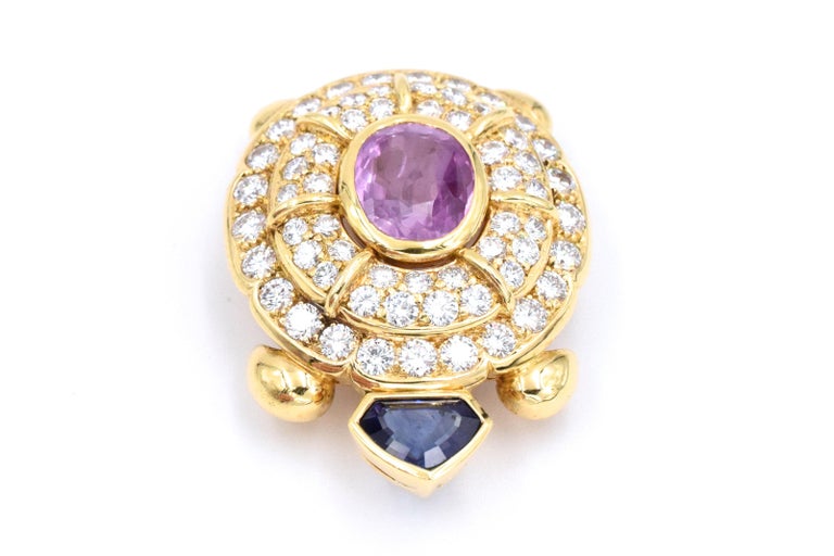 Beautiful pink & blue sapphire with diamonds turtle brooch.
The brooch is composed of:
Oval shape pink sapphire weighs 6.50carat
Blue sapphire, weighs 1.50carat
Brilliant cut diamonds, weigh approximately 4.40carat
Set in 18k yellow gold.
