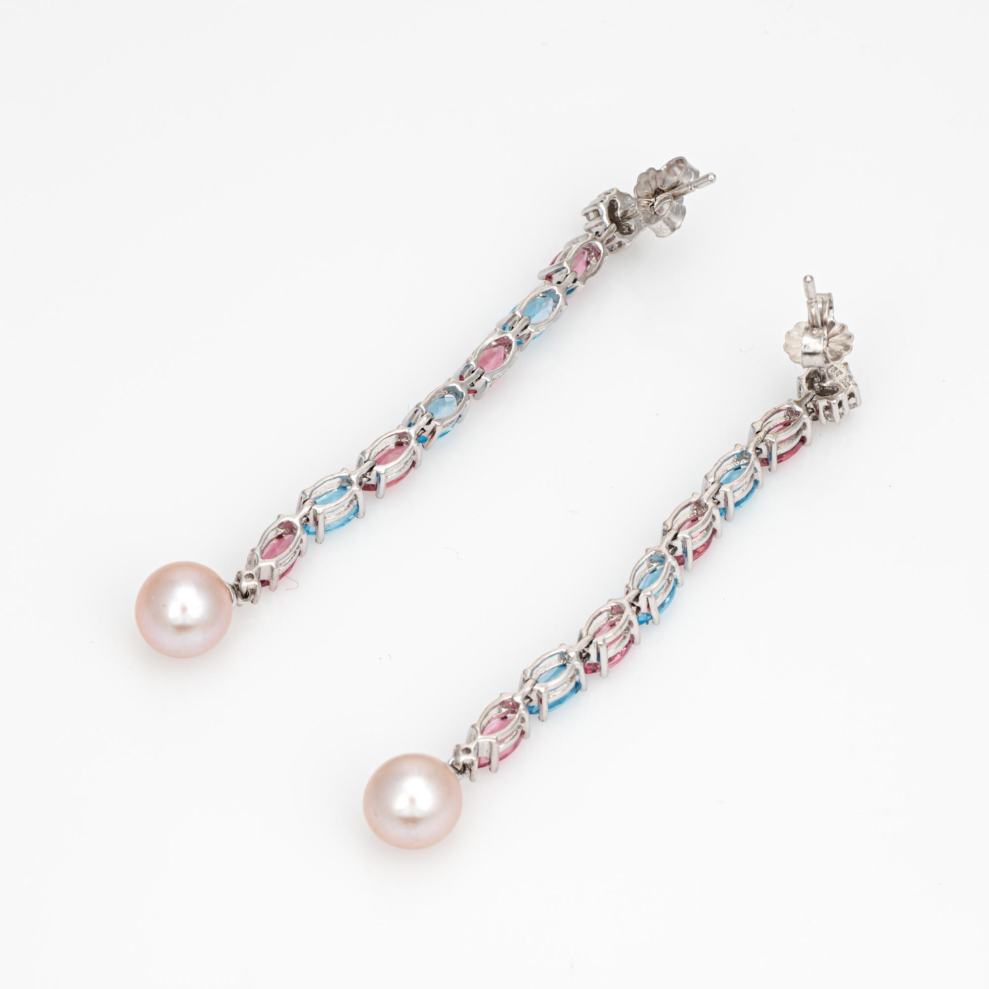 Stylish pair of blue & pink topaz drop earrings, crafted in 14k white gold. 

Oval faceted blue & pink topaz total an estimated 3.50 carats. Diamonds total an estimated 0.10 carats (estimated at H-I color and I1-2 clarity). Cultured pearls measure