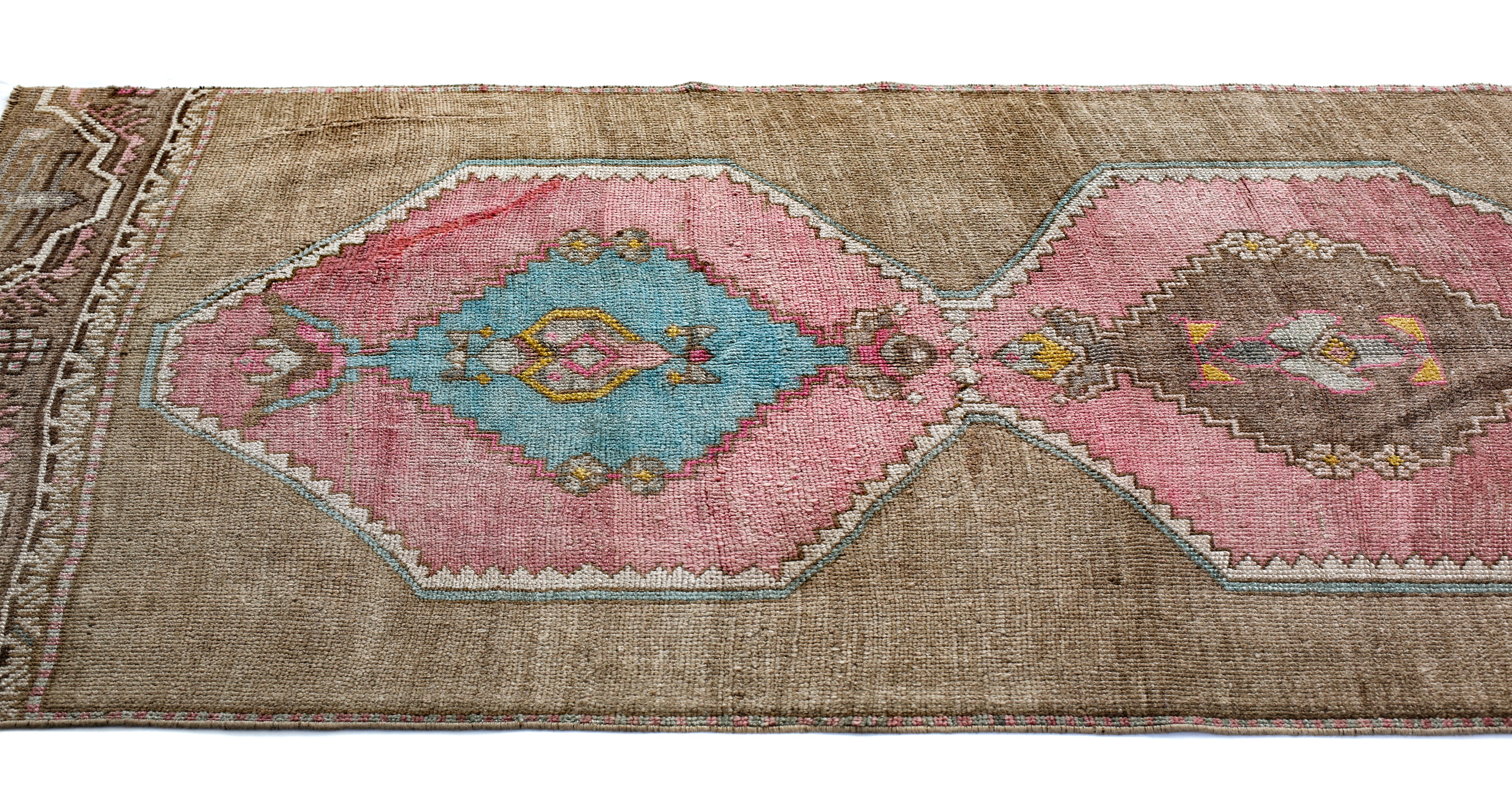 Anatolian rugs are hand knotted in the Central Anatolia or Asia Minor region of Turkey. The patterns are from Ottoman era as well as modern Turkey. The central medallion used in this rug symbolizes the central authority of the Ottoman Sultans. In