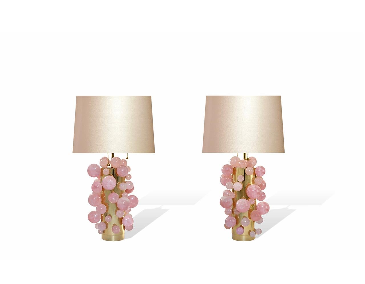 Pair of pink rock crystal bubble lamps with polished brass finishes, created by Phoenix Gallery, NYC. Measures: To the rock crystal part 13in / H. Overall height 25 inch High,Lampshade is not included.