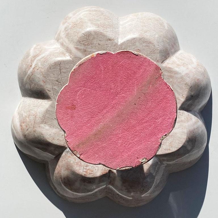 A beautiful carved circular pink stone marble fruit bowl which sits upon a pink stone pedestal base. With gorgeous veining in pale pinks and whites, this decorative bowl will add the subtle detail in it's new home. Its edges are scalloped and