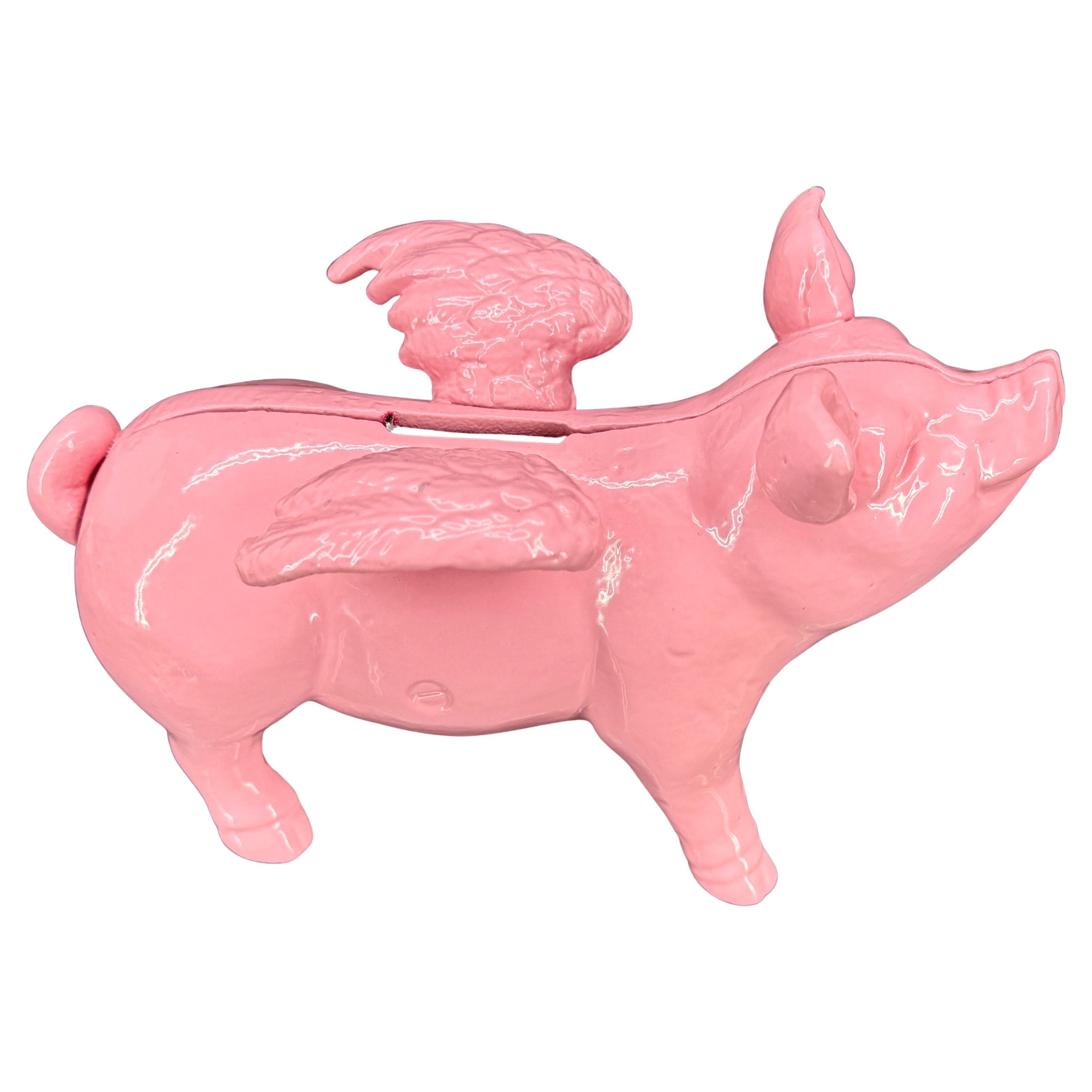 Danish piggy pink cast iron money bank or doorstopper with wings.
This smiling and charming Lady Pig is newly powder-coated in 