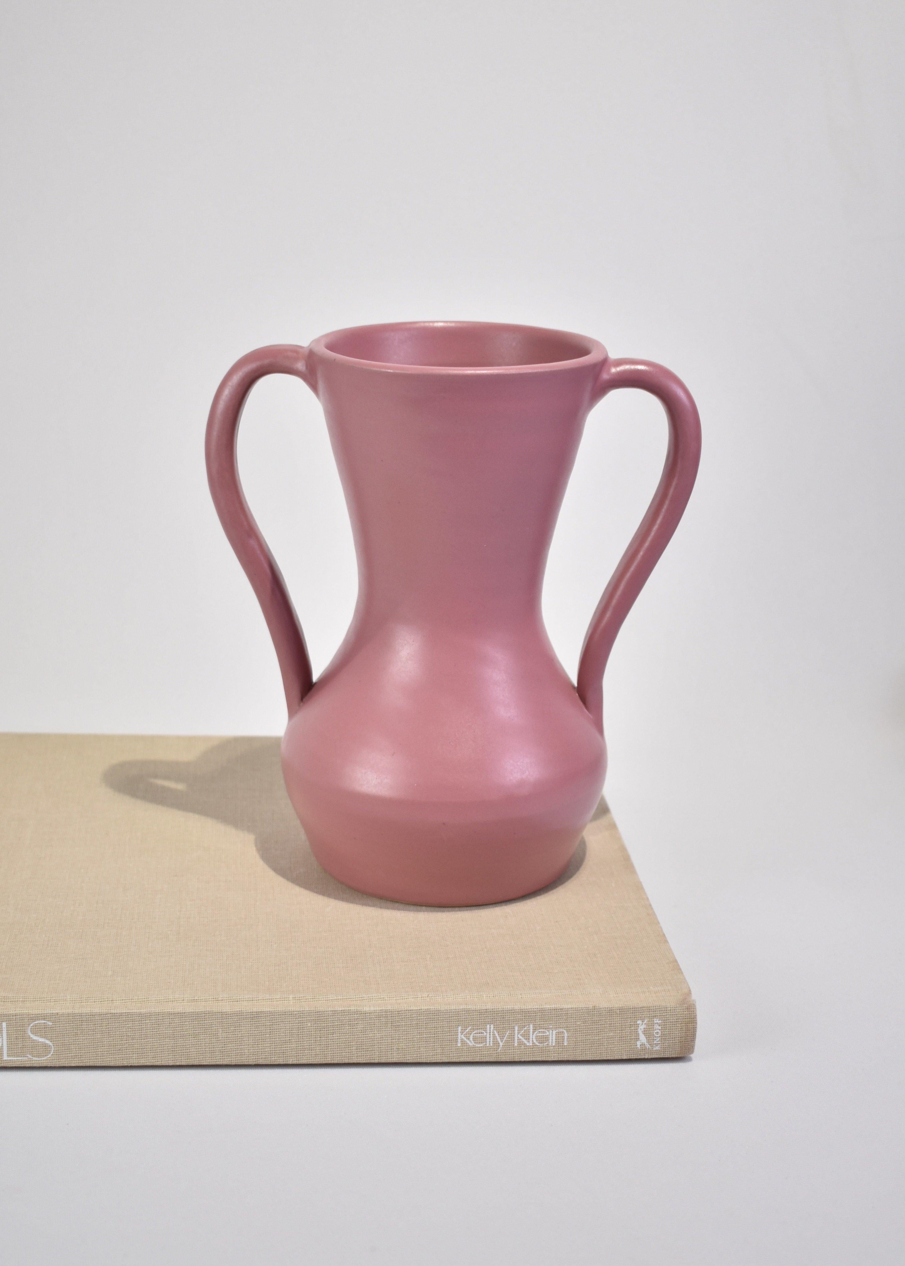Stunning vintage ceramic double handled amphora style vase in a beautiful shade of pink with slight sheen. Stamped on base Kentucky Hand Made Pottery.
 