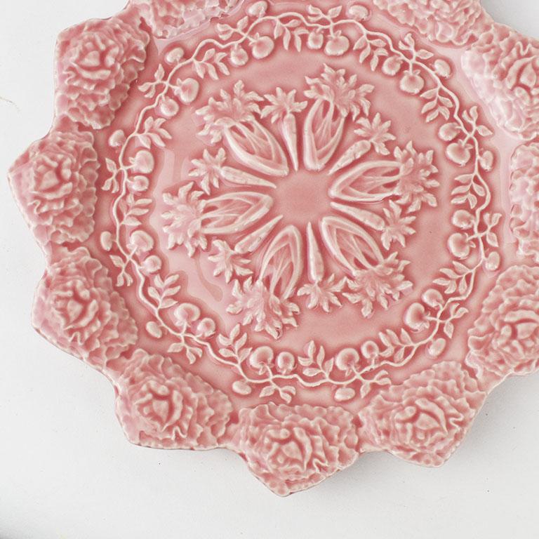 A beautiful Spring themed soft pink carrot and cabbage motif accent plate by Rafael Bordallo Pinheiro. This plate has a textured embossed garden design. The rim is scalloped with embossed cabbages, and the center of the plate features embossed