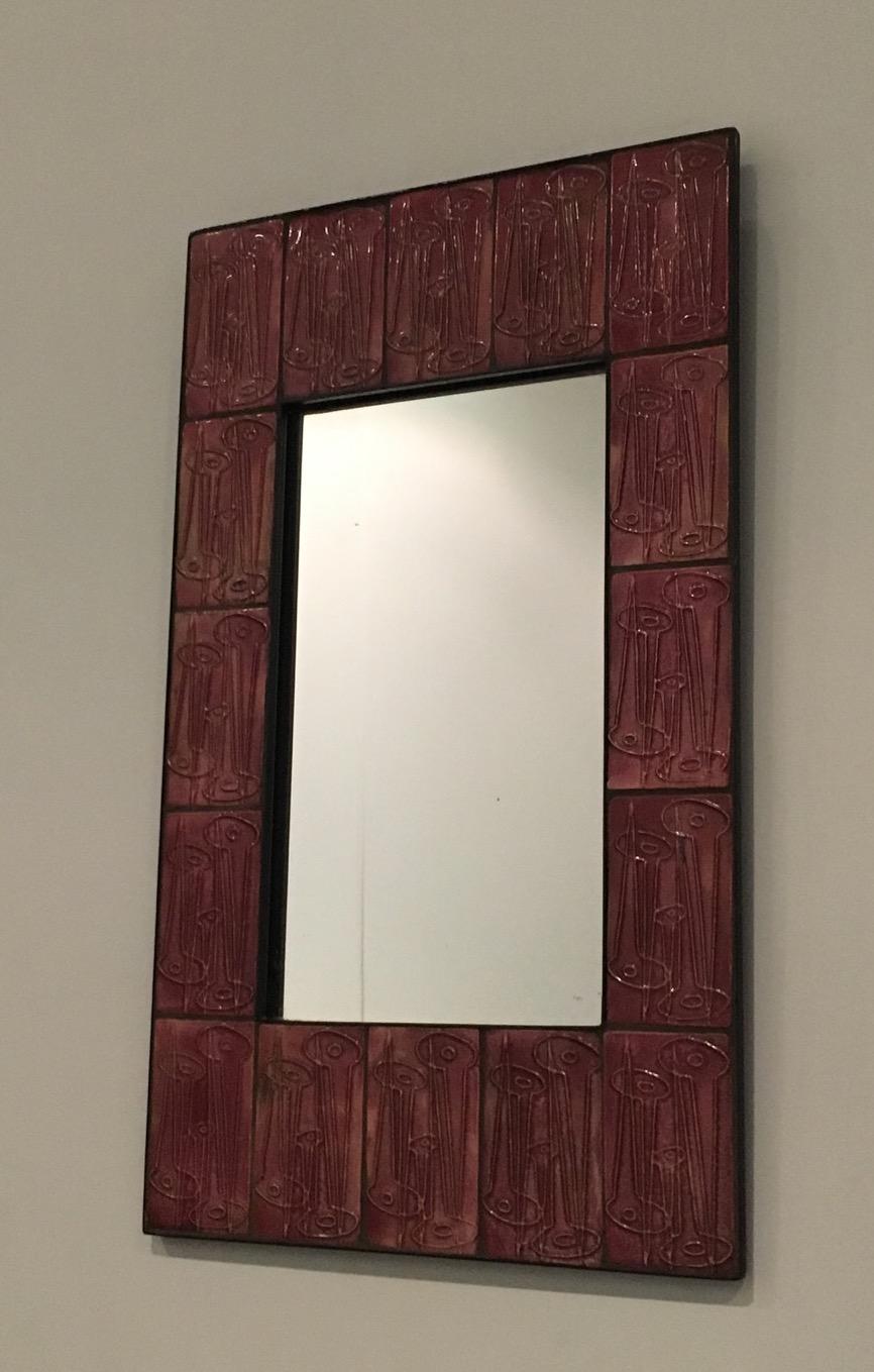 This nice and unusual pink mirror is made of ceramic. This is a French work. There is a mark on the back of the mirror. Circa 1970