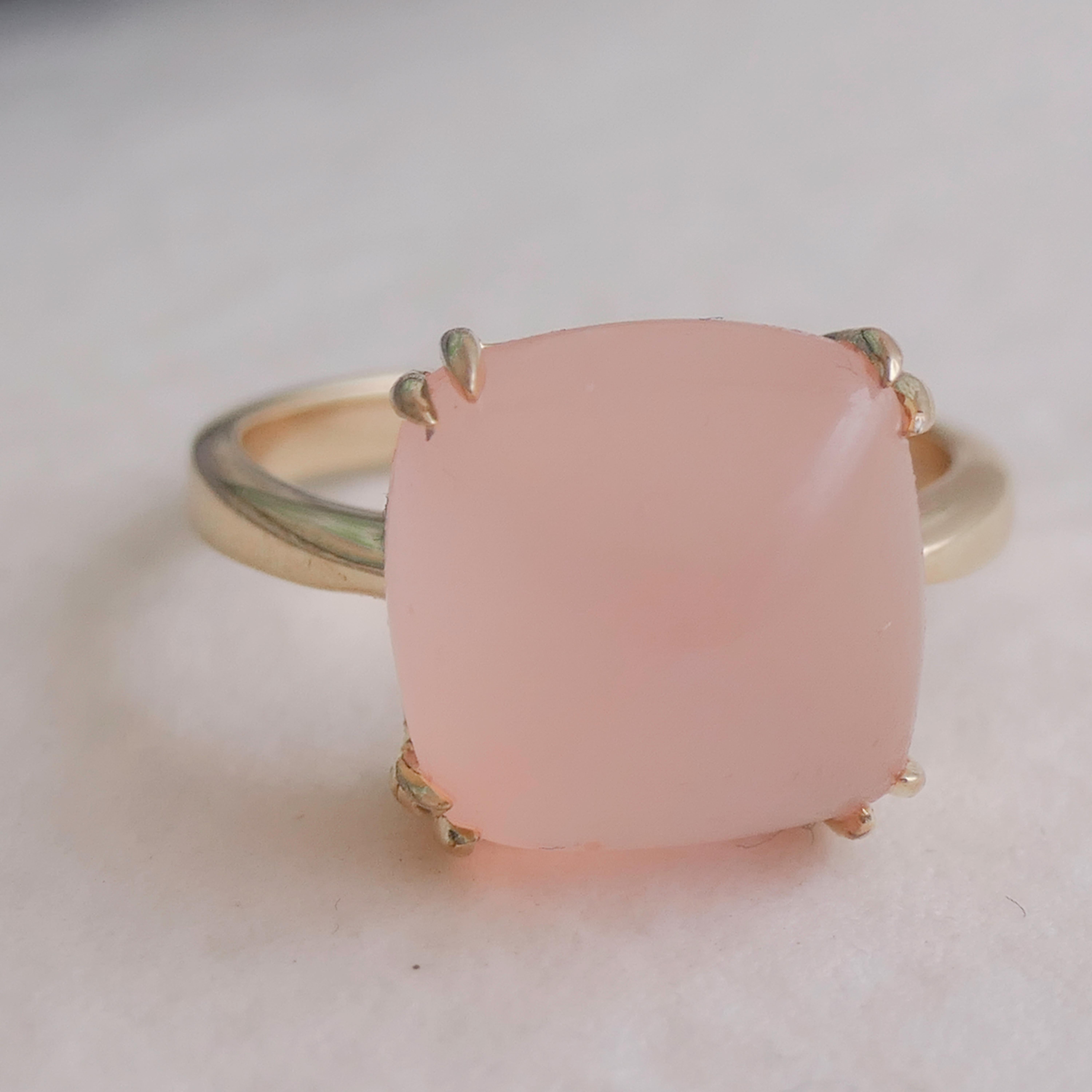 Features a 12x12mm Sugar Loaf cut Pink Chalcedony gemstone, expertly prong-set in high-quality gold plated sterling silver.
Handcrafted with attention to detail, ensuring a unique and exquisite piece of jewelry.
The rich pink  hue of the chalcedony