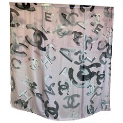 Pink Chanel stole with gray lettering