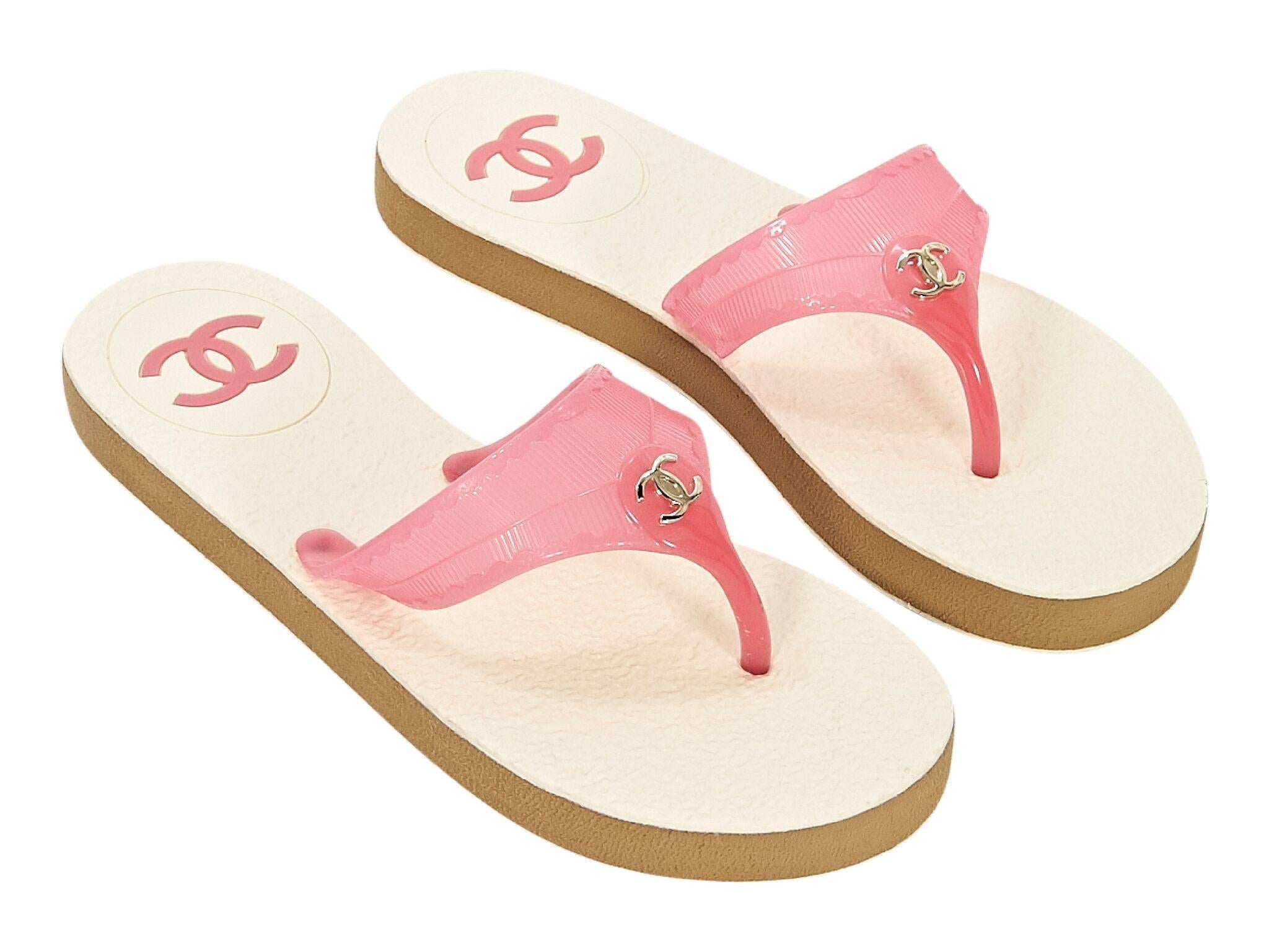Product details:  Pink thong sandals by Chanel.  Slip-on style.
Condition: Pre-owned. Never worn. 
Est. Retail $915