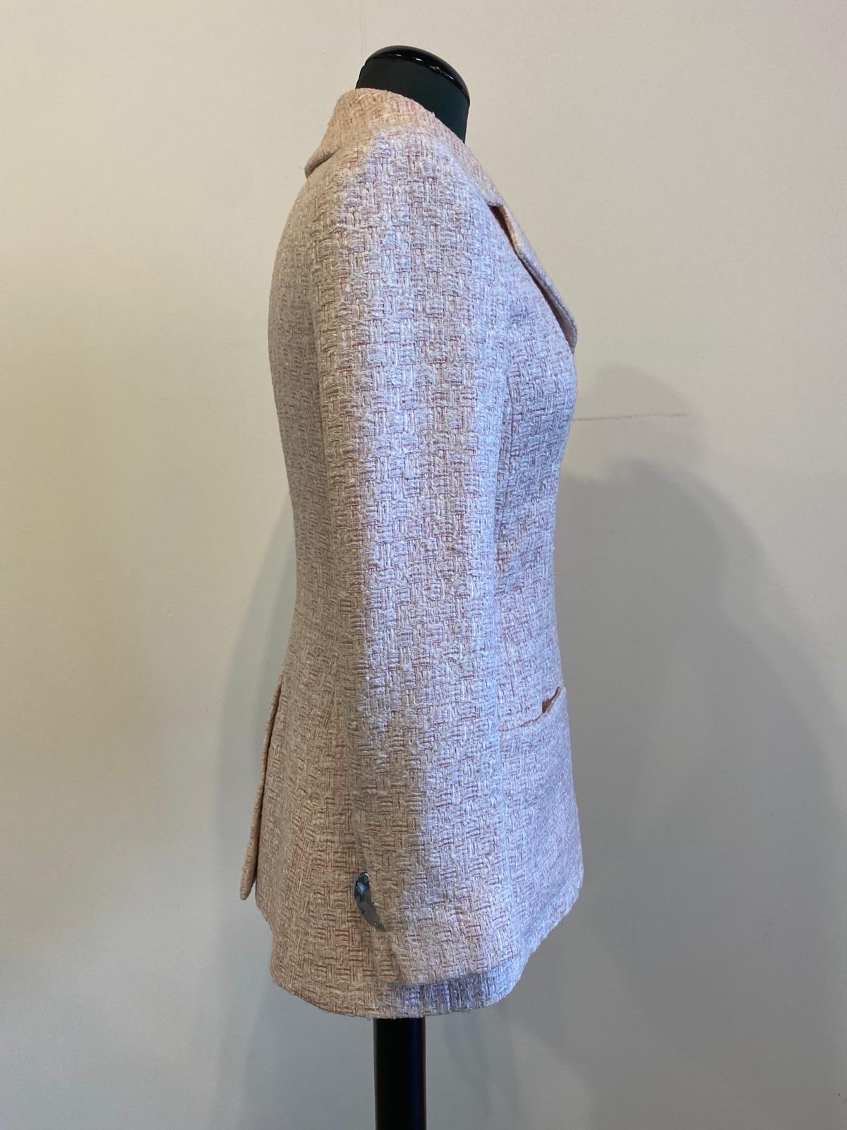 Chanel tweed jacket in poly silk and cotton in shades of pastel pink with silver jewel buttons on the sleeves. From the 2016 show. 
Closure with hooks and side pockets. 
70 cm long
Shoulders 36 cm
Chest 44 cm
Sleeve 58 cm
Tg. F 34
In excellent