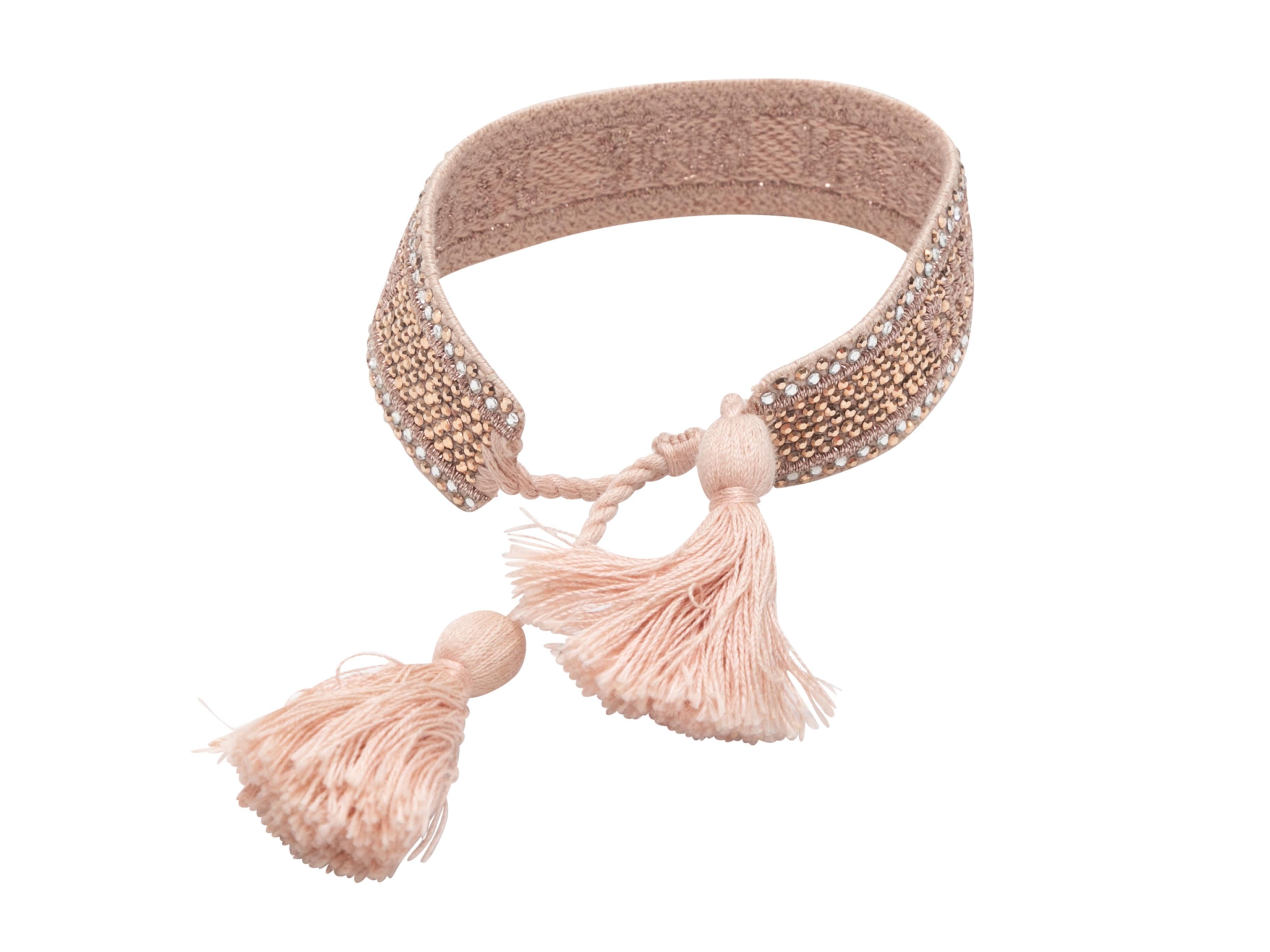 Pink woven crystal-embellished bracelet by Christian Dior. Tassel trim at ends. 0.75