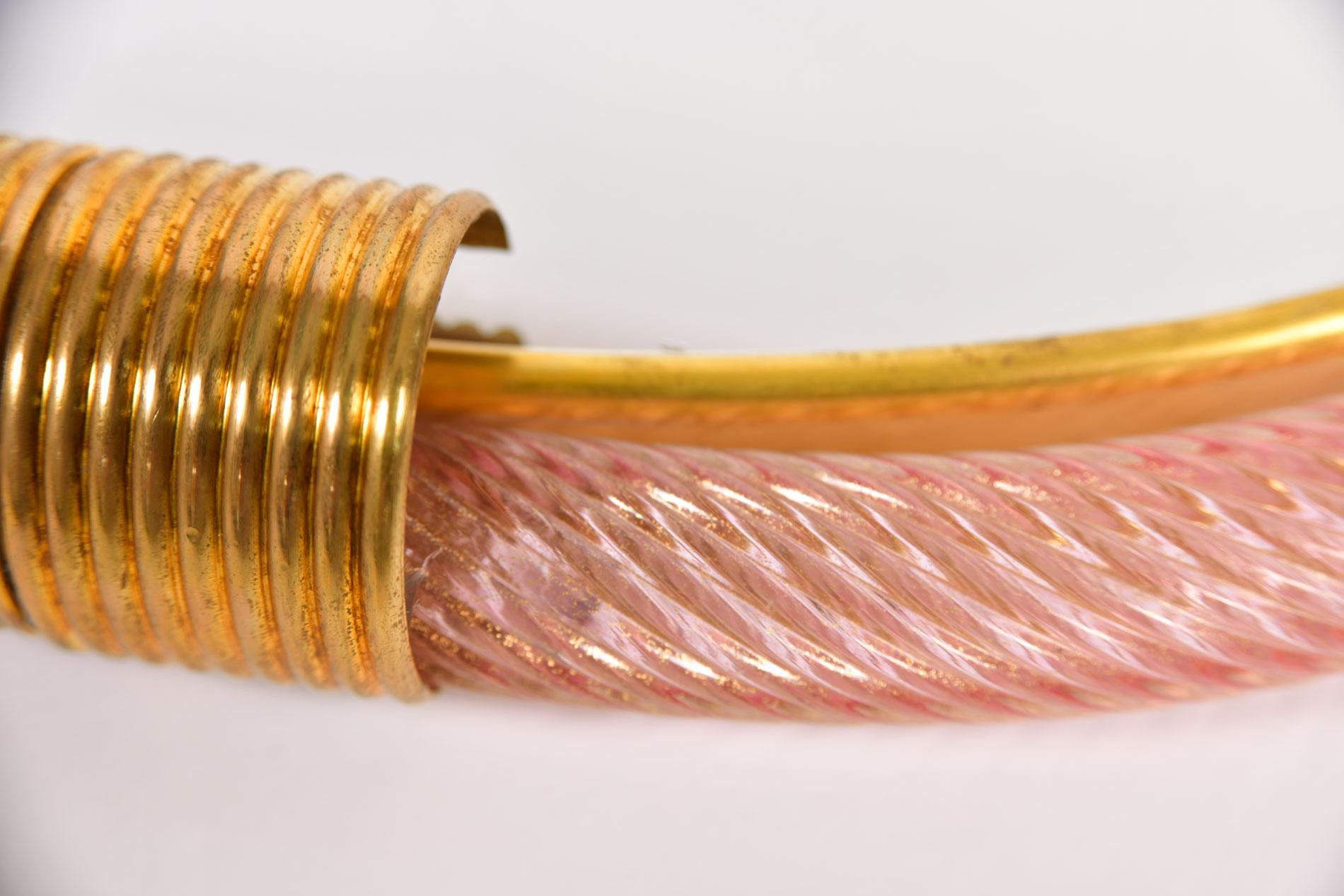 Palest pink ribbed hand blown Murano glass circular mirror with two brass fluted clasps at the top and bottom, the inner edge lined with slender brass filet.

Also available in pale blue.

6 week lead-time if not in stock.