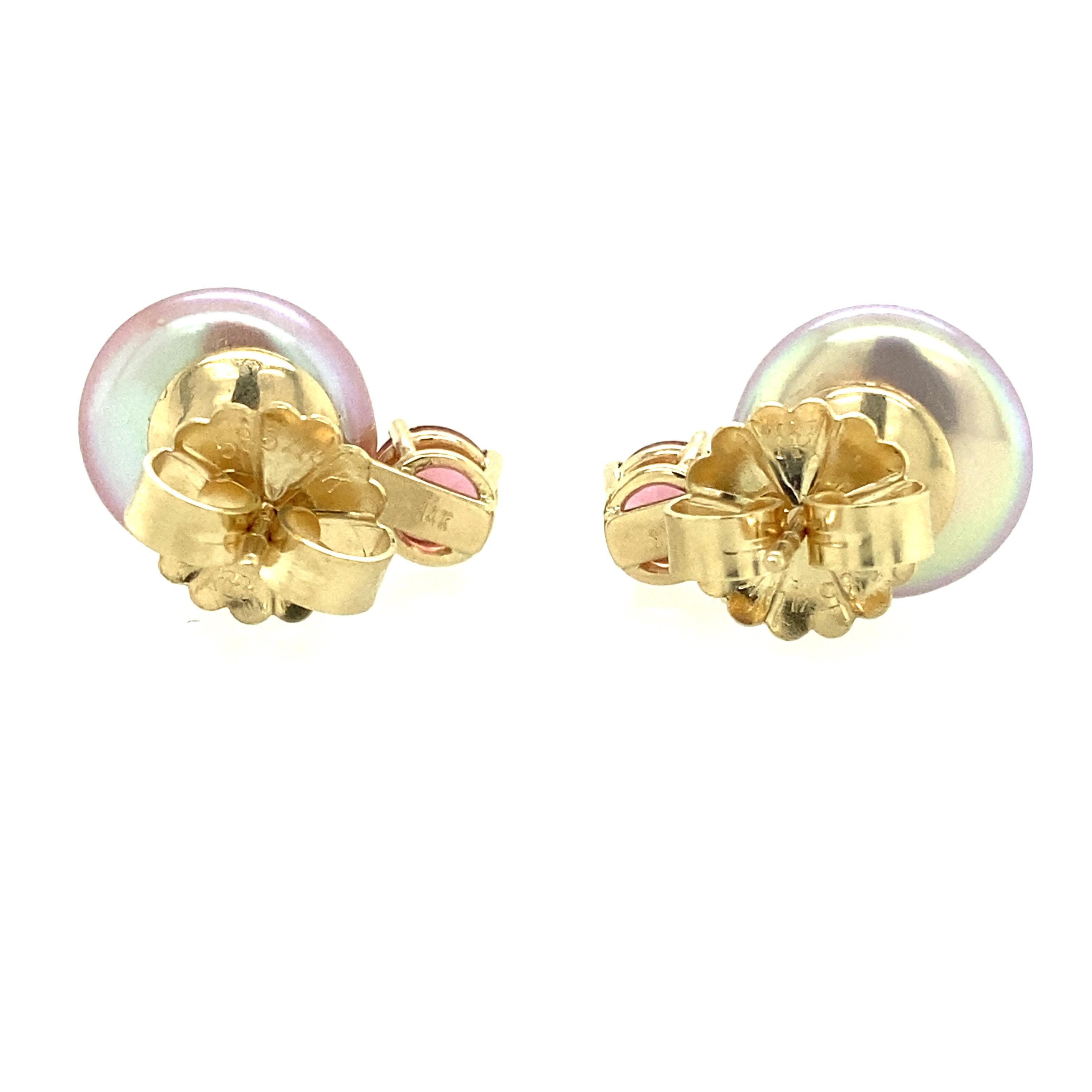 One pair of 14 karat yellow gold (stamped 14K) estate drop earrings each set with one 12.3mm pink coin freshwater pearl and one 5.5mm pink tourmaline.  The earrings measure 18.3mm long and are complete with friction posts and backs.