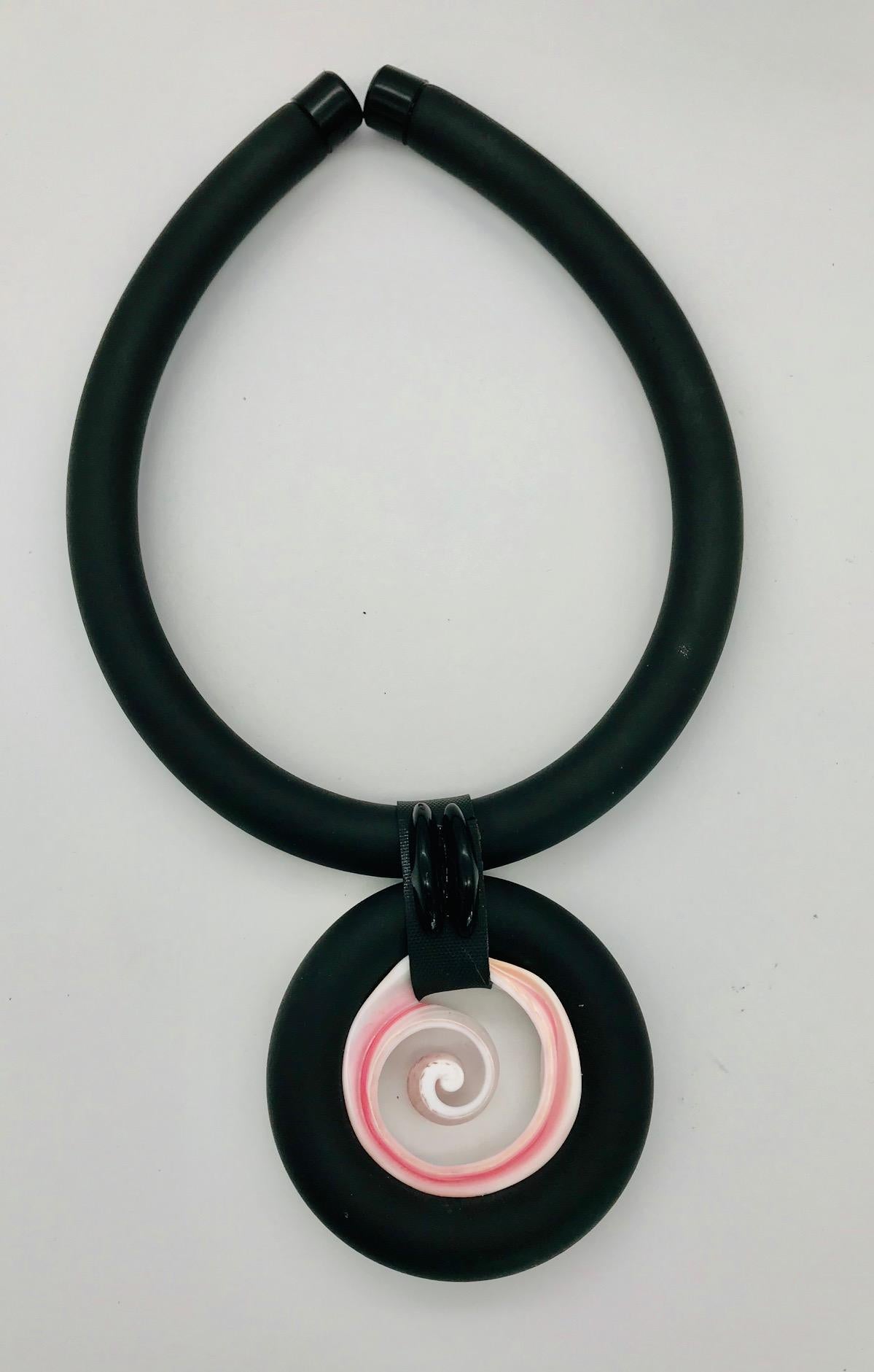 
This Necklace/Choker is made from porcelain like pink color  Conch which is eco –luxe, and eco -friendly. The pink Conch is a shell from Caribbean Sea it is harvested wild and as a by-product of sustainable food aquaculture. The Conch shell is the