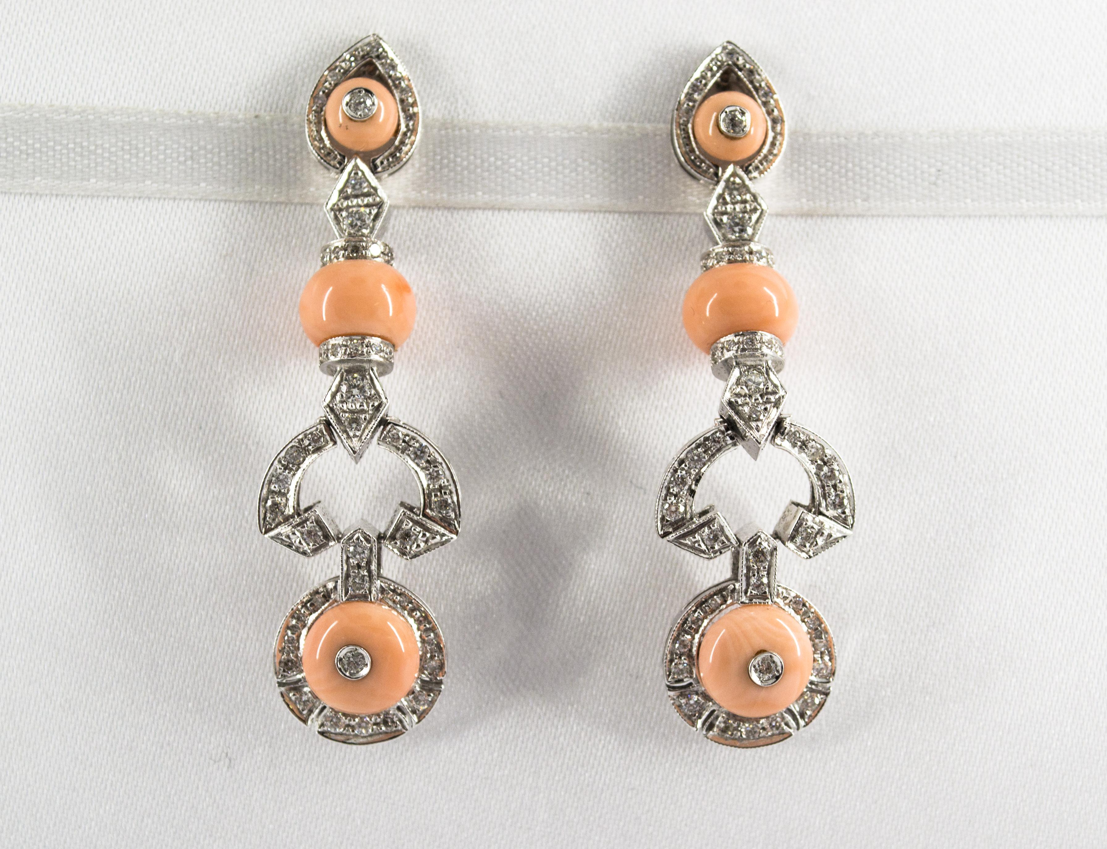 These Earrings are made of 9K White Gold.
These Earrings have 0.40 Carats of White Diamonds.
These Earrings have also Pink Coral.
All our Earrings have pins for pierced ears but we can change the closure and make any of our Earrings suitable even