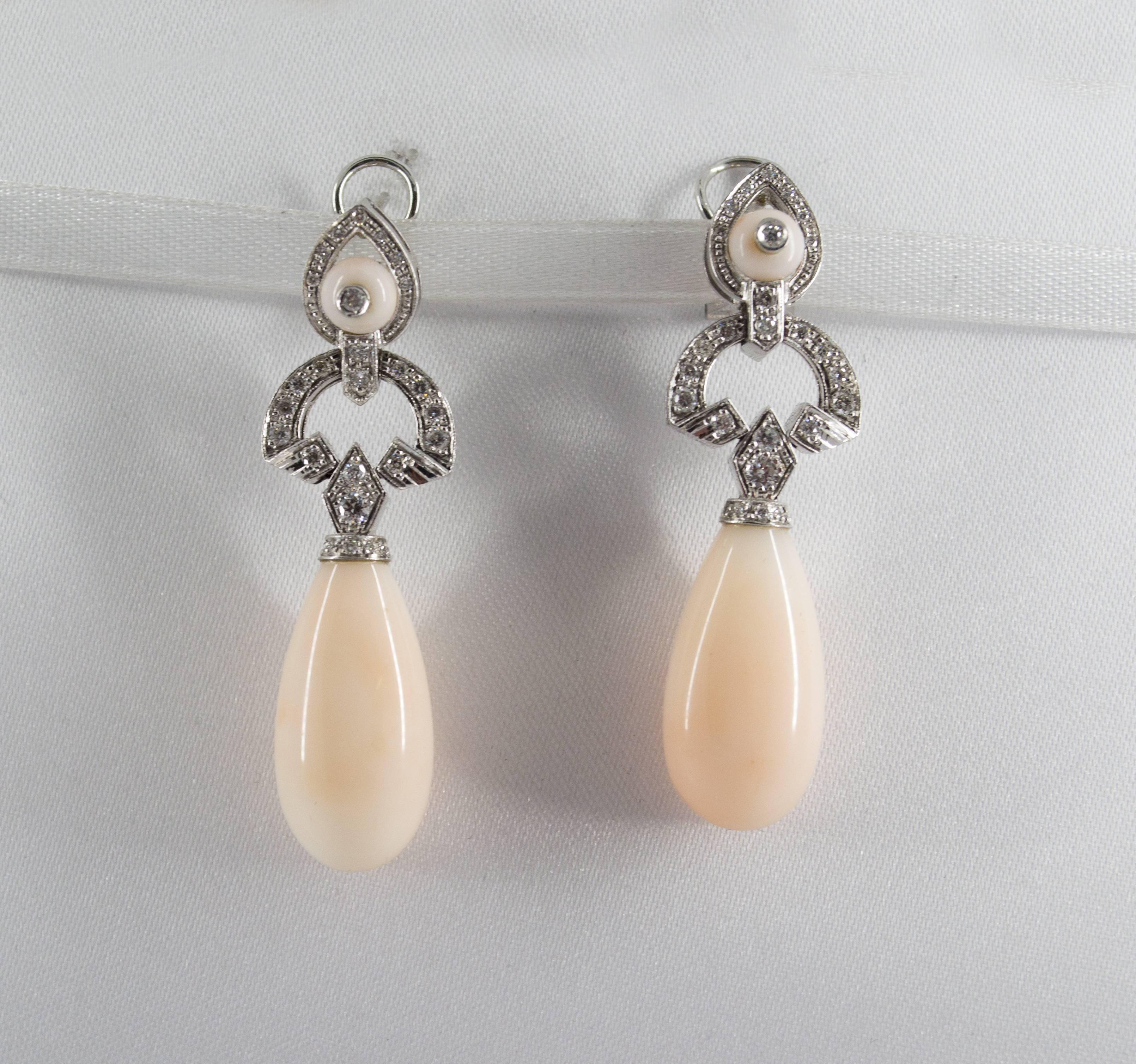 These Earrings are made of 9K White Gold.
These Earrings have 0.90 Carats of White Diamonds.
These Earrings have Pink Coral.
All our Earrings have pins for pierced ears but we can change the closure and make any of our Earrings suitable even for