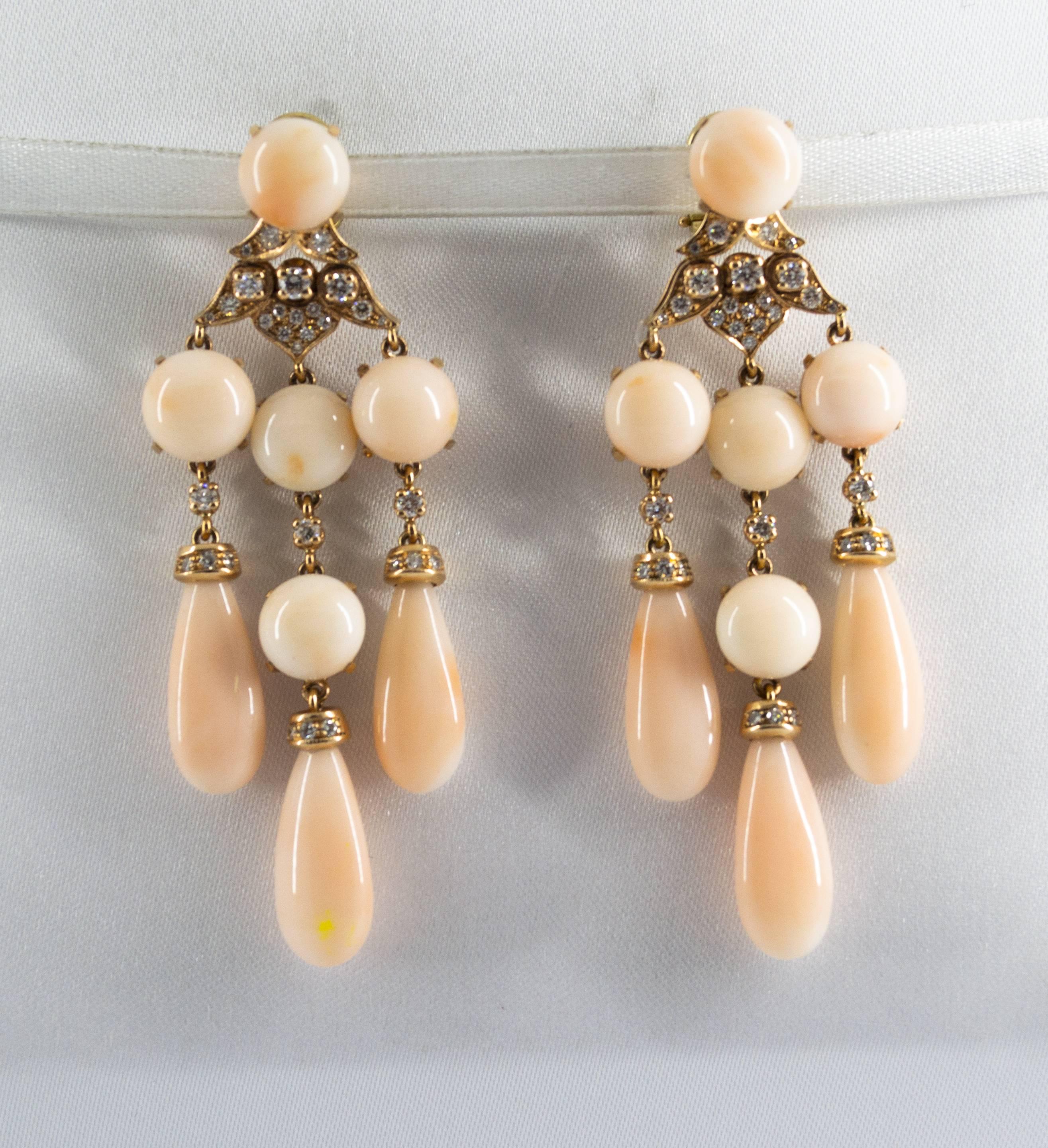 These Earrings are made of 14K Yellow Gold.
These Earrings have 1.25 Carats of White Diamonds.
These Earrings have also Pink Coral.
All our Earrings have pins for pierced ears but we can change the closure and make any of our Earrings suitable even