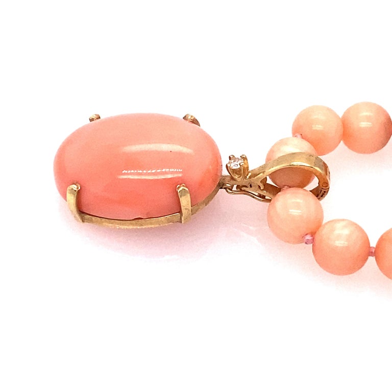 Pink Coral Beaded Necklace with Oval Enhancer in 18 Karat Gold For Sale