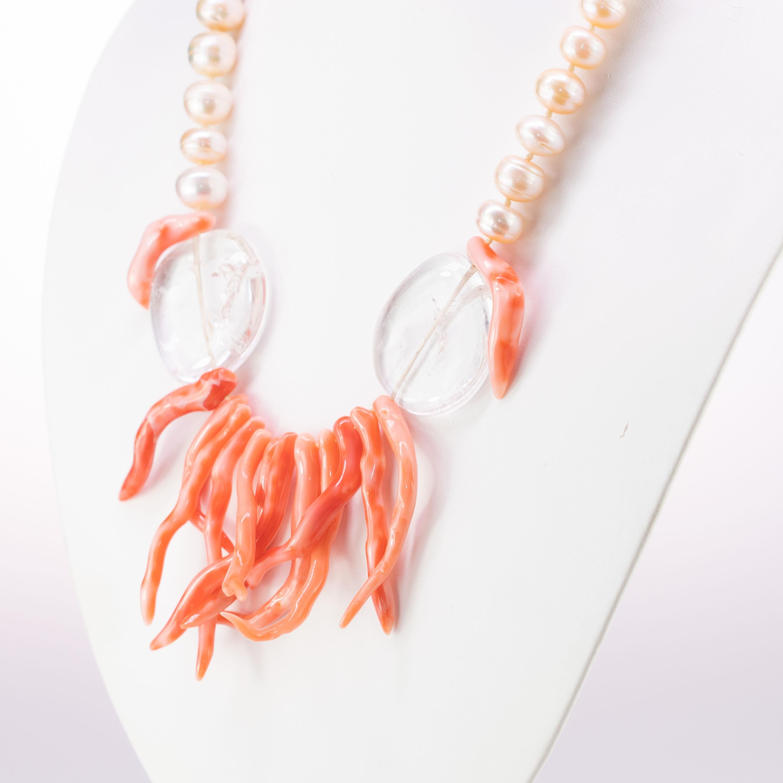 Immerse yourself in the beauty of this uniquely designed necklace with natural pink coral, freshwater pearls and crystal rocks.
 
This design is inspired by the corals of the Australian Great Barrier Reef. A subtle and harmonious jewel. The warm