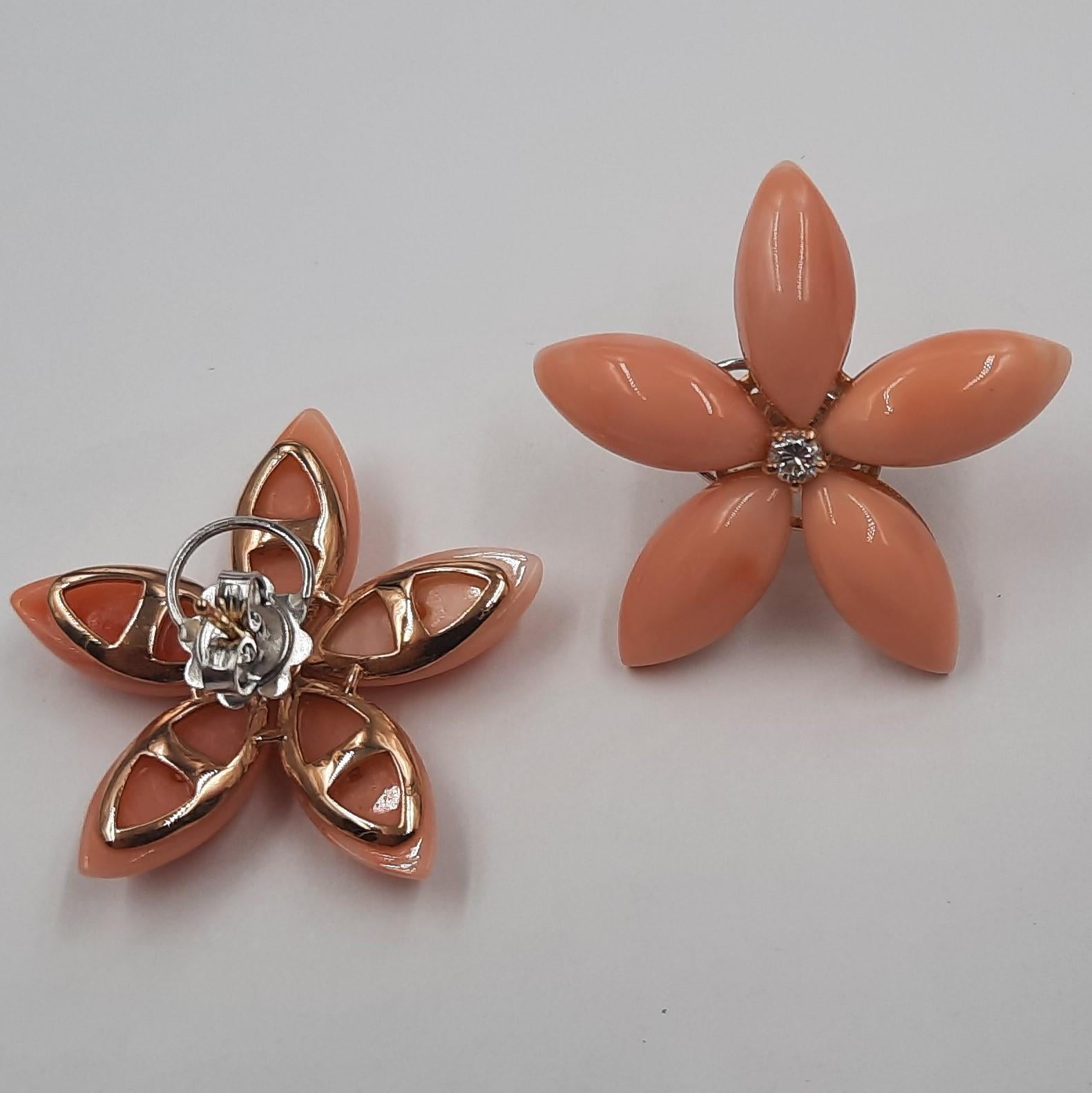 Pretty pink natural coral (5.7 grams), brilliant cut diamond (0.18 carats) and 18 carats  white gold (4.8 grams) flower earrings. They are replicable, even smaller and with coral of a different color (for example red). See Listings.The earrings are