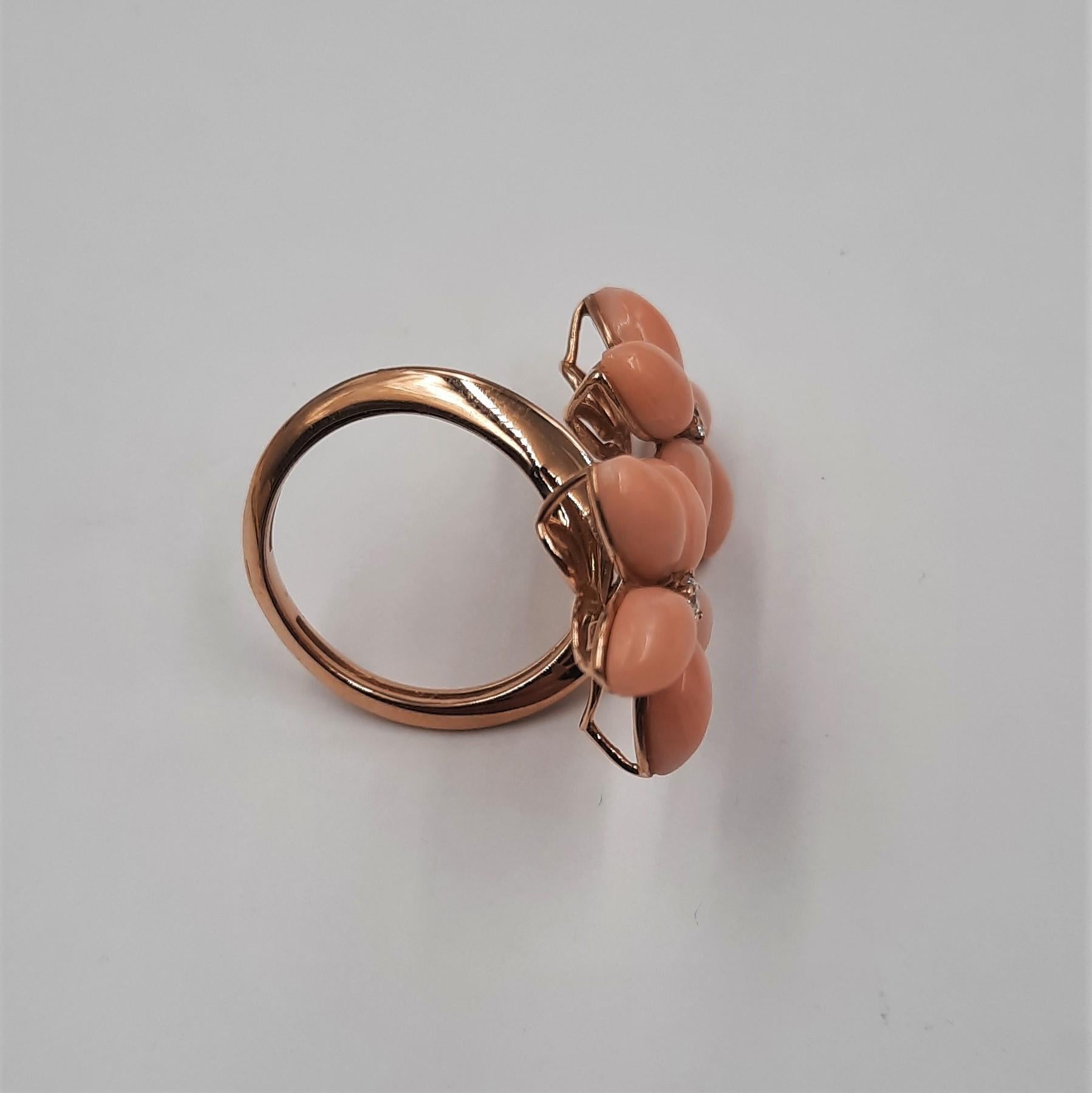Pretty pink natural coral (1.3 grams), brilliant cut diamond (0.09 carats) and 18 carats  yellow gold (5.8 grams) flower earrings.  It is replicable, with coral of a different color (for example red). See Listings. The ring are eventually part of a