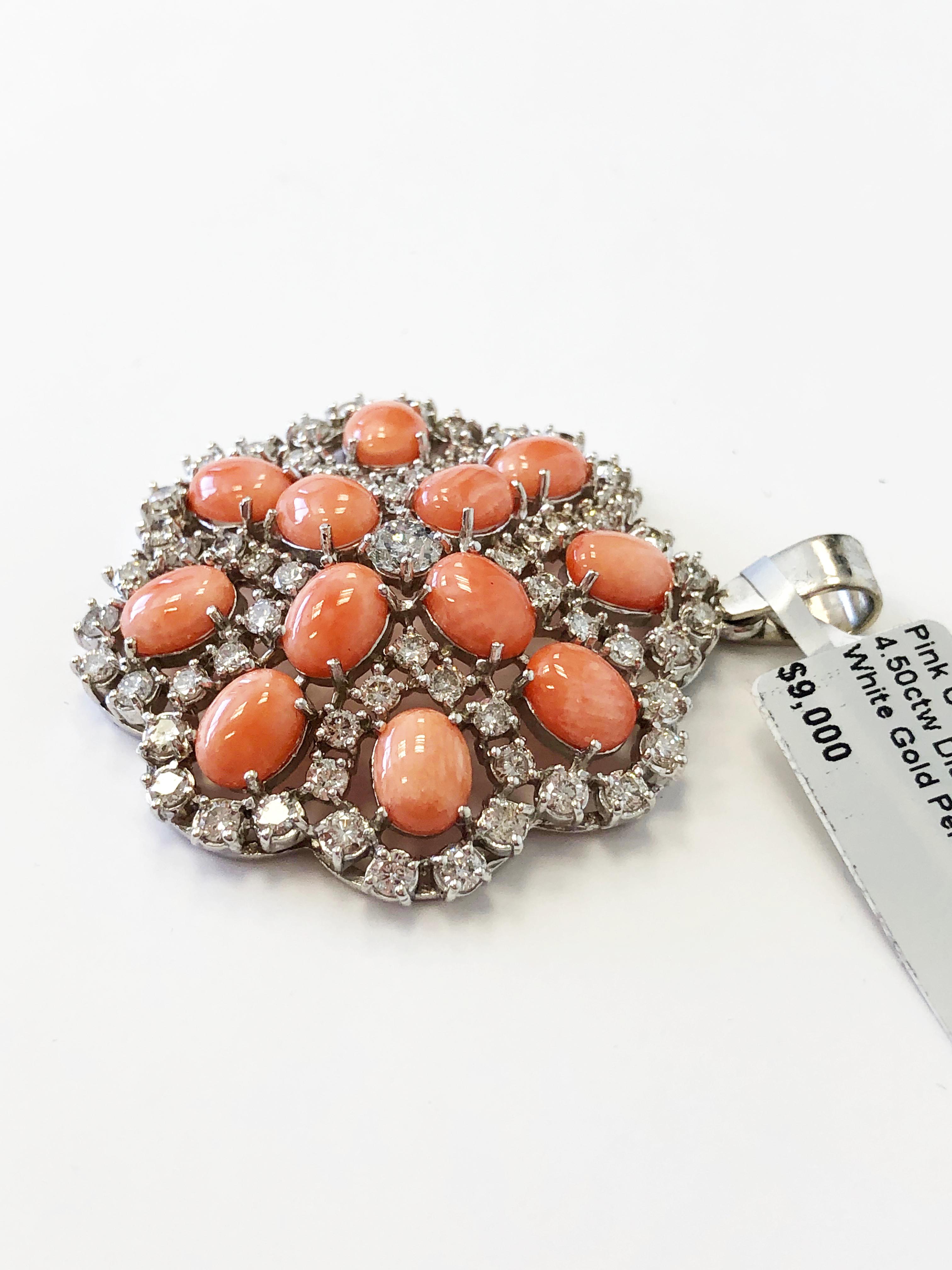 Gorgeous oval pink coral cabochons with 4.50 carats of good quality white diamond rounds in a handmade 14k white gold pendant.  Perfect for someone who likes a bit of color and unique design.

 
