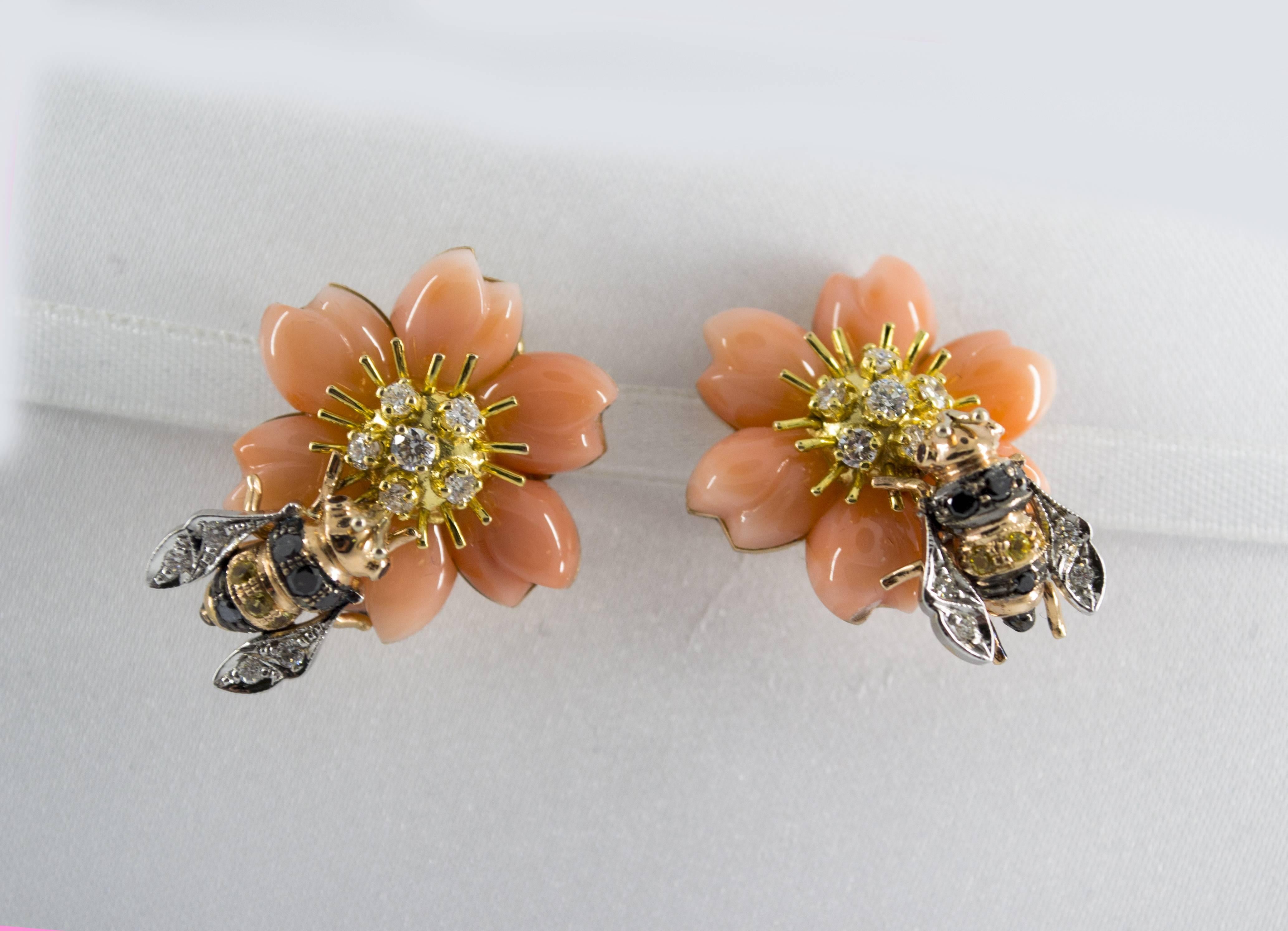 These Earrings are made of 14K Yellow Gold.
These Earrings have 1.10 Carats of White Diamonds.
These Earrings have 0.20 Carats of Yellow Sapphires.
These Earrings have Pink Coral.
All our Earrings have pins for pierced ears but we can change the