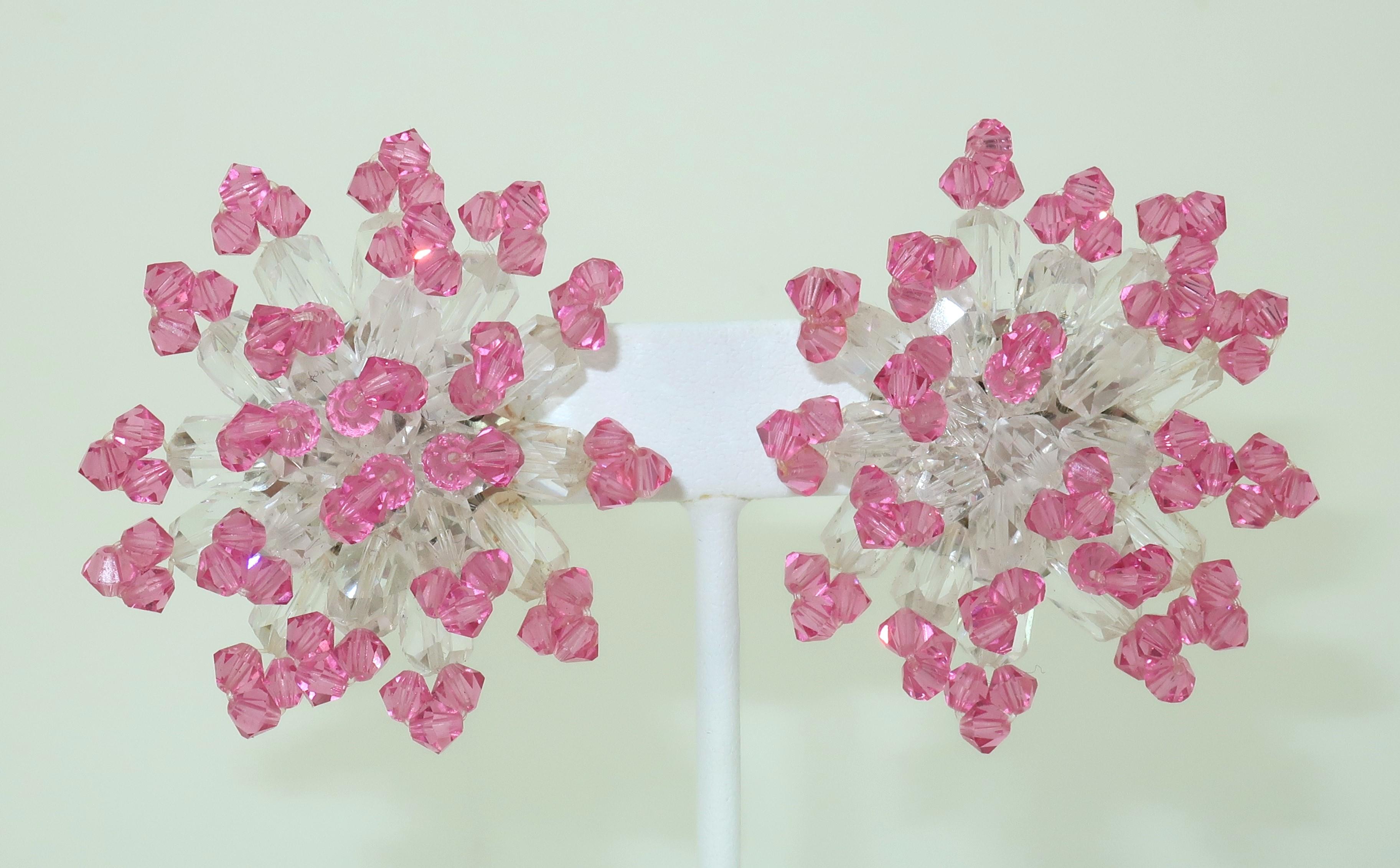 Pretty in pink!  C.1980 pink and clear crystal beaded clip on earrings.  The intricate beading forms a floral style cluster that catches the light and creates a wonderful sparkle.  The earrings are not hallmarked though they are well made and come