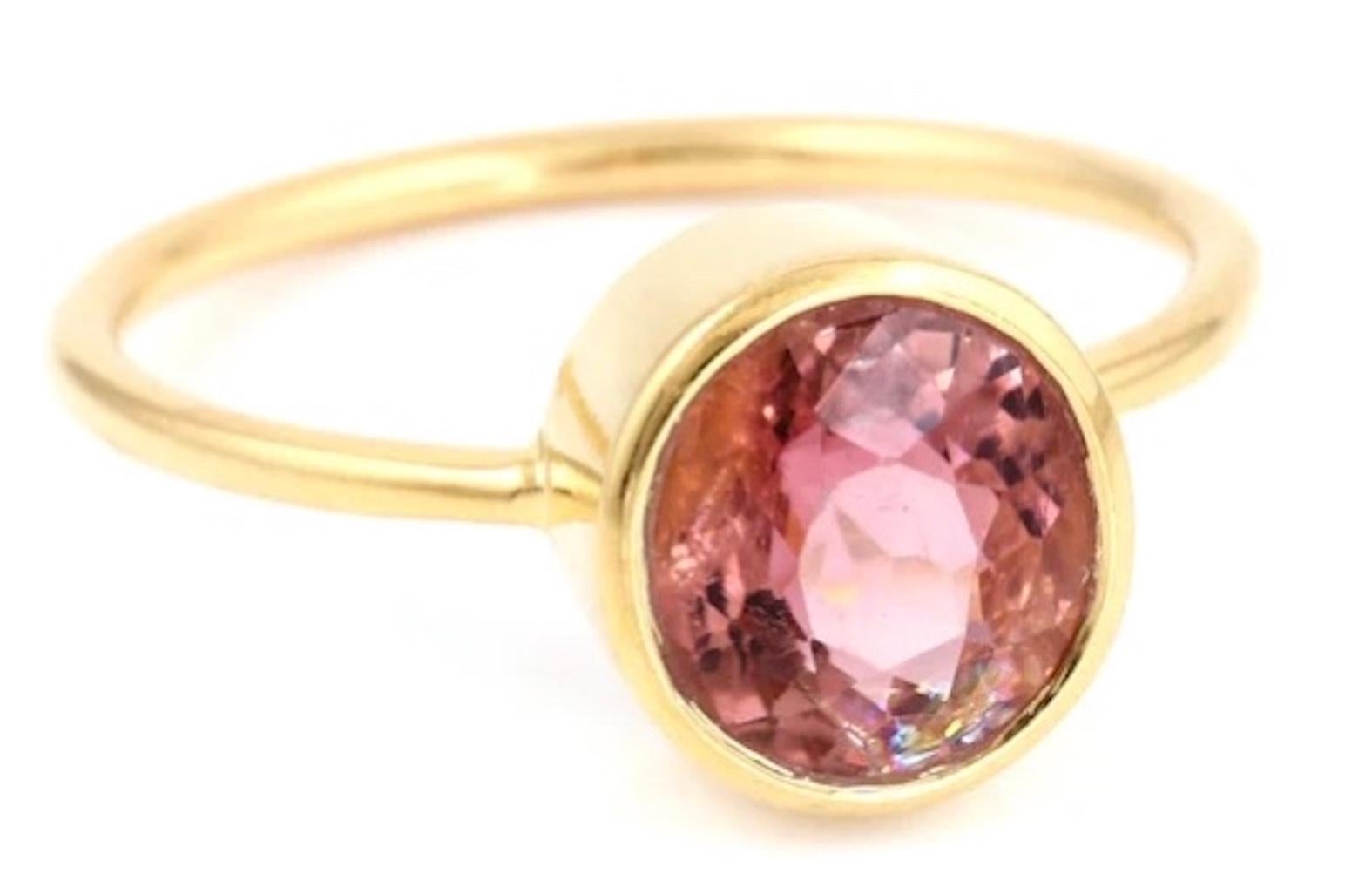 Pink Currant Tourmaline Dress Ring features a bezel set pink tourmaline . A simple yet stylish dress ring.

- Pink Tourmaline 1.90 carats.
- Set in 22 karat ion plated gold over sterling silver.
- Ring is currently size 7 and resizable.
