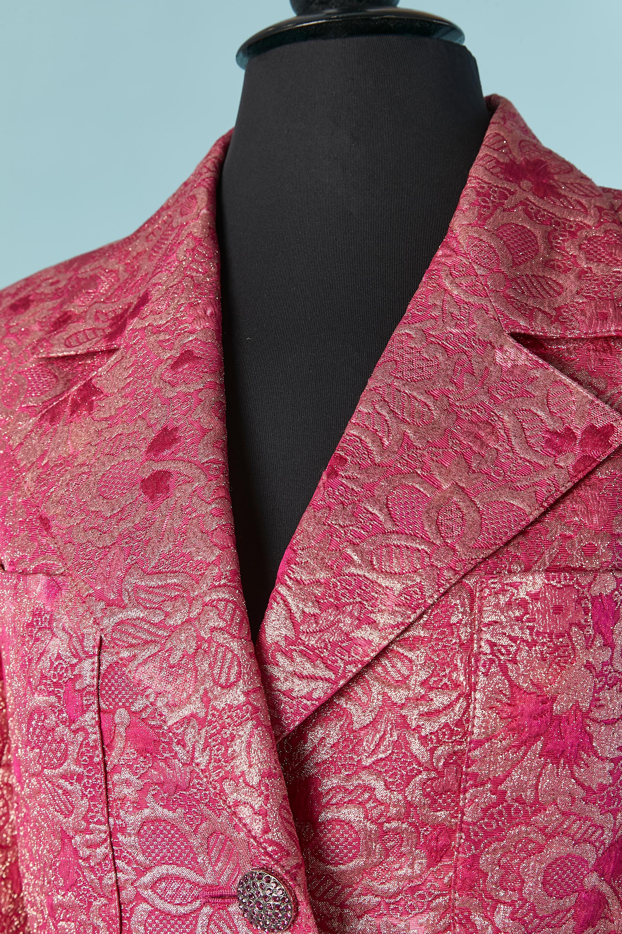 Pink damask silk, wool and lurex evening skirt suit with rhinestone button. Shell fabric composition: 45% wool, 40% silk, 15% lurex. No fabric composition tag for the lining but probably rayon or acetate. 
Rhinestone button and buttonhole closure on