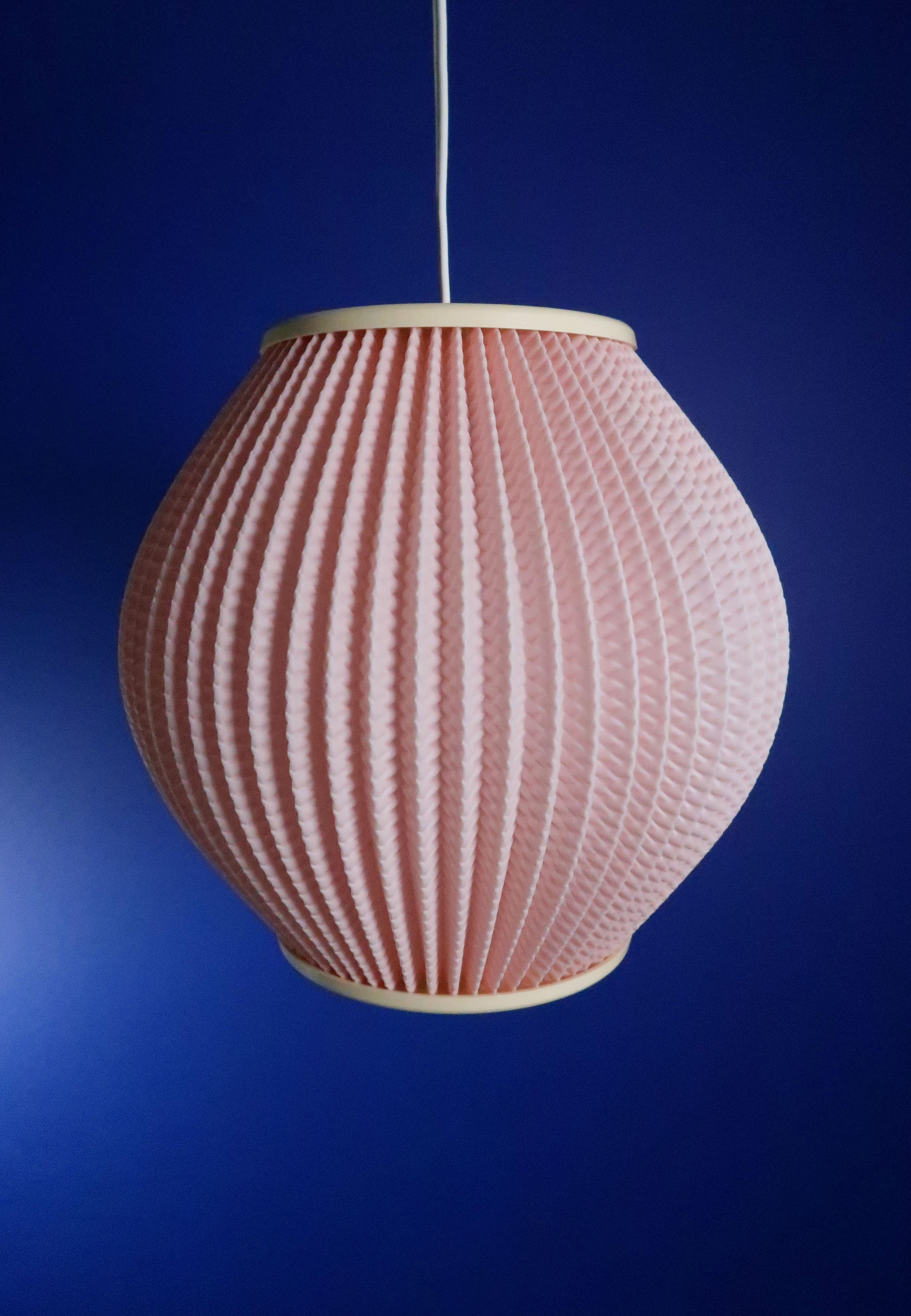 Pink Danish Mid-Century Modern pleated acrylic pendant with cream top and bottom. Designed by Lars Eiler Schiøler in 1960 for Hoyrup light. Model 