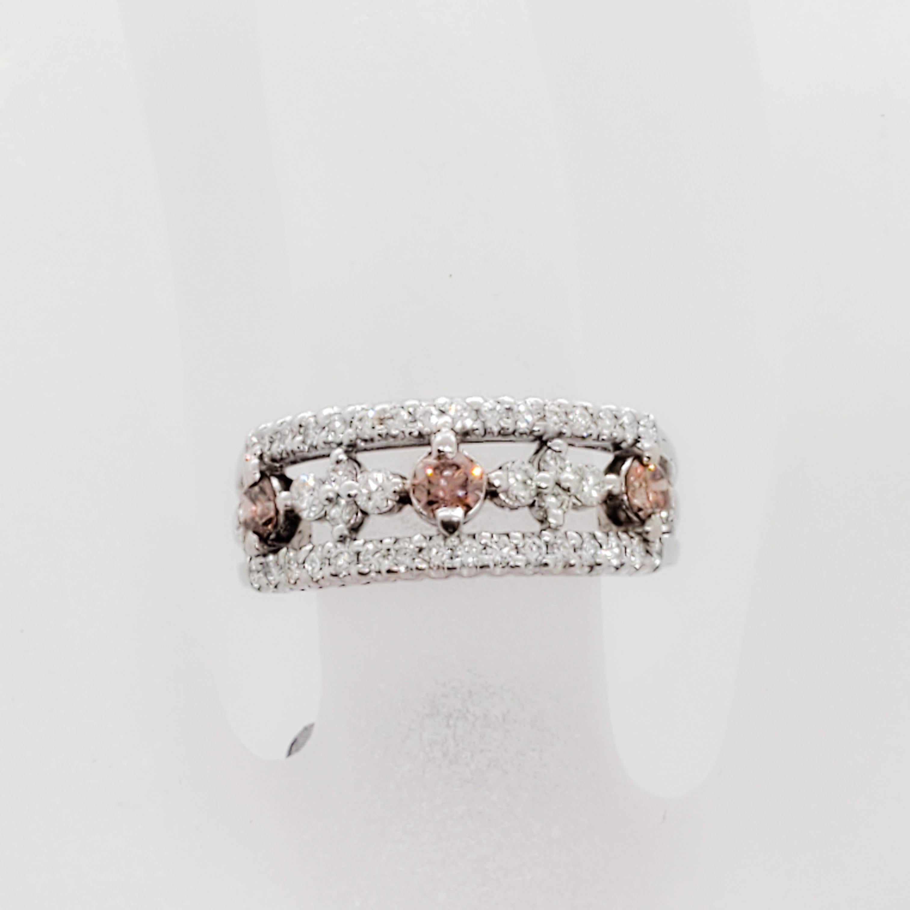 Round Cut Pink Diamond and White Diamond Band in Platinum