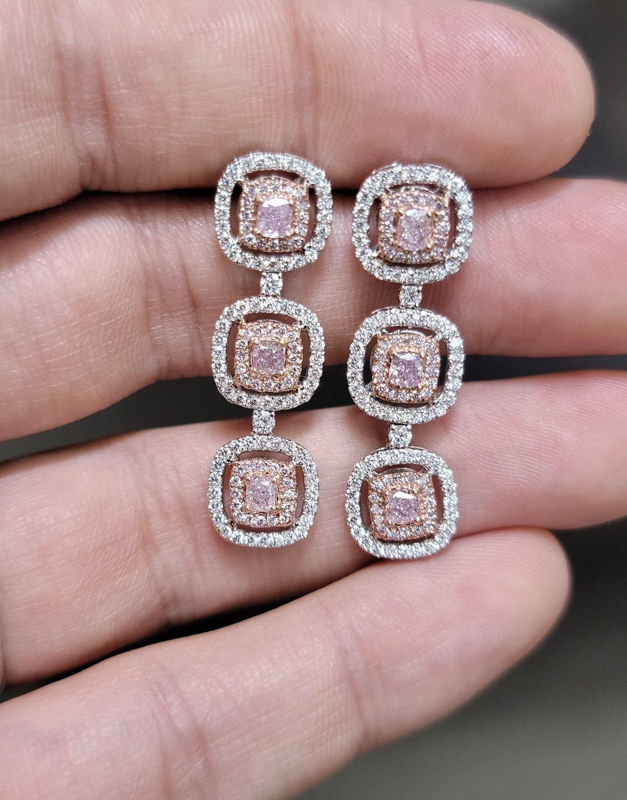 Gorgeous Pink Diamond three cushion double halo earrings, set in White and Rose Gold, with 2.6ct of natural pink and white diamonds
Featured are Pink cushion cut diamonds surrounded by pink and white diamond halos.  These are the ultimate elegant