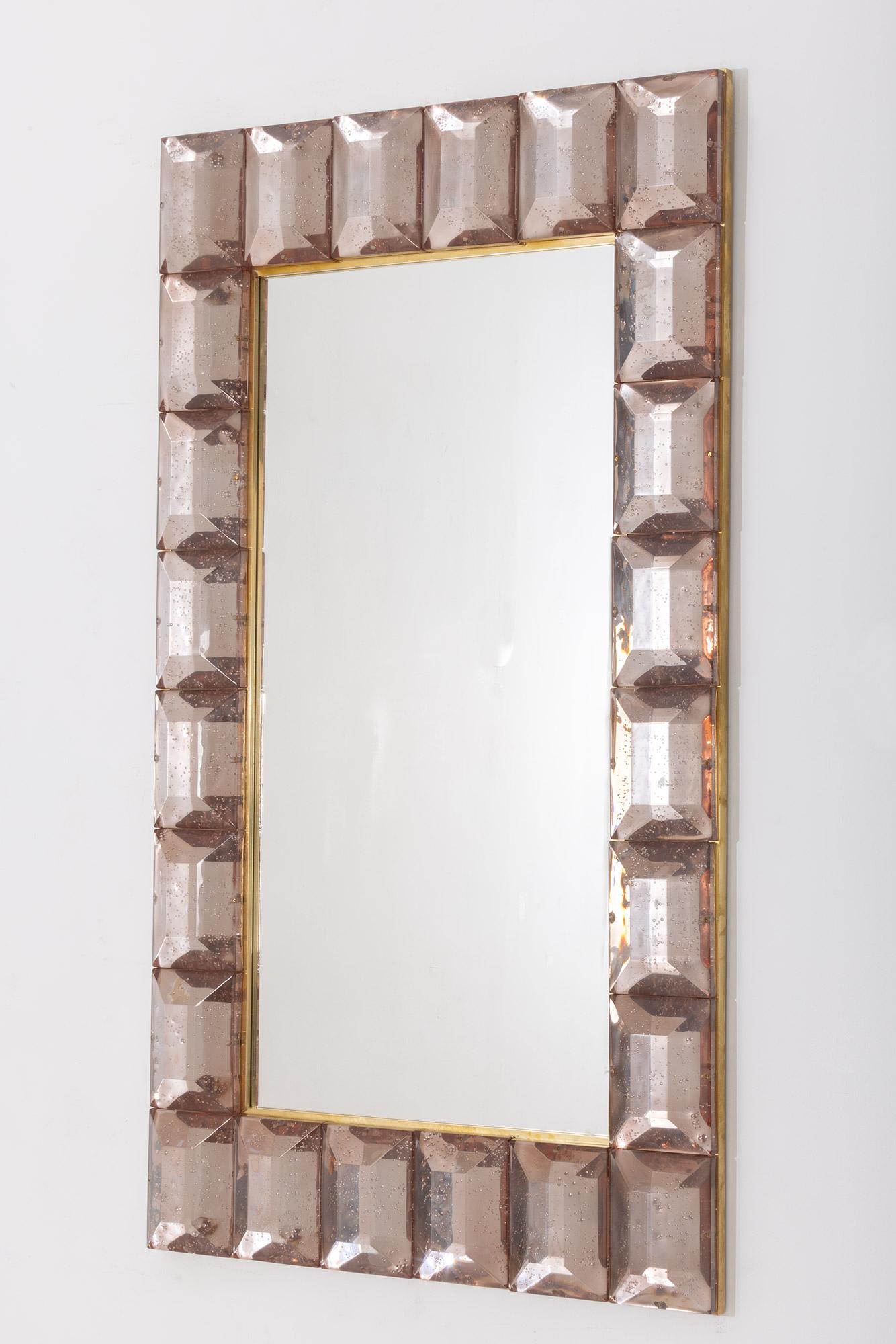 Large pink diamond cut Murano glass mirrors, in stock
Contemporary and customizable mirror with a faceted Murano glass frame, edged in brass and luxury handcrafted by a team of artisans in Venice, Italy.
Each pink glass block has a highly polished