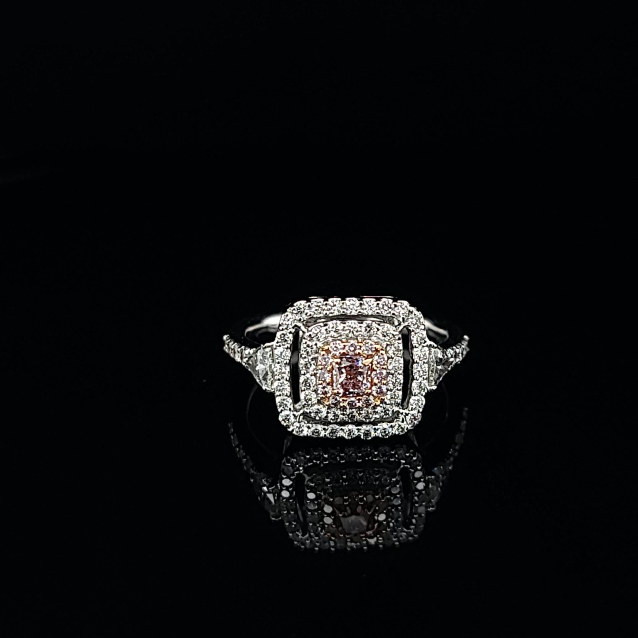 Contemporary Pink Diamond Ring Featuring a 0.20-Carat Center Accented by a Stunning Halo For Sale