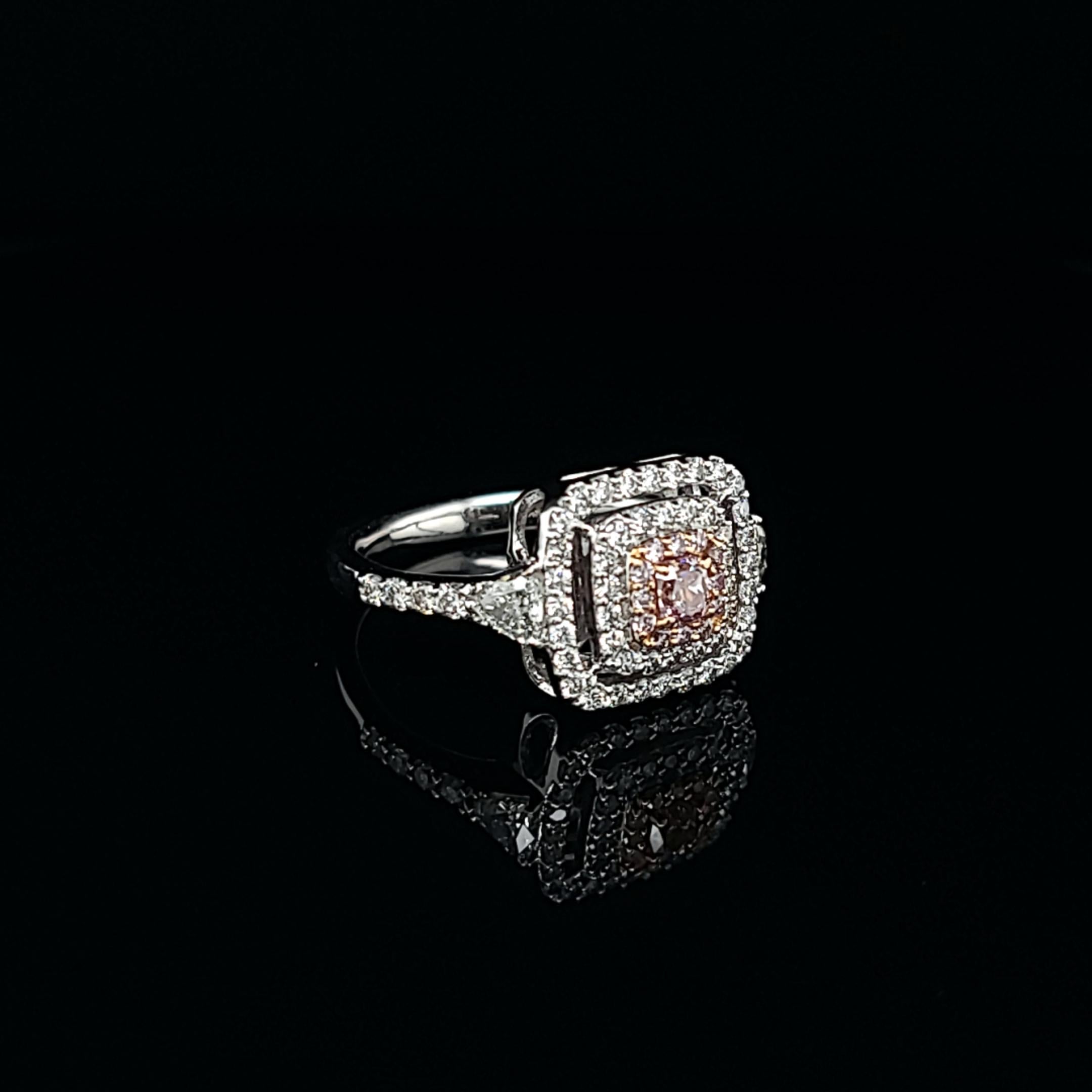 Cushion Cut Pink Diamond Ring Featuring a 0.20-Carat Center Accented by a Stunning Halo For Sale