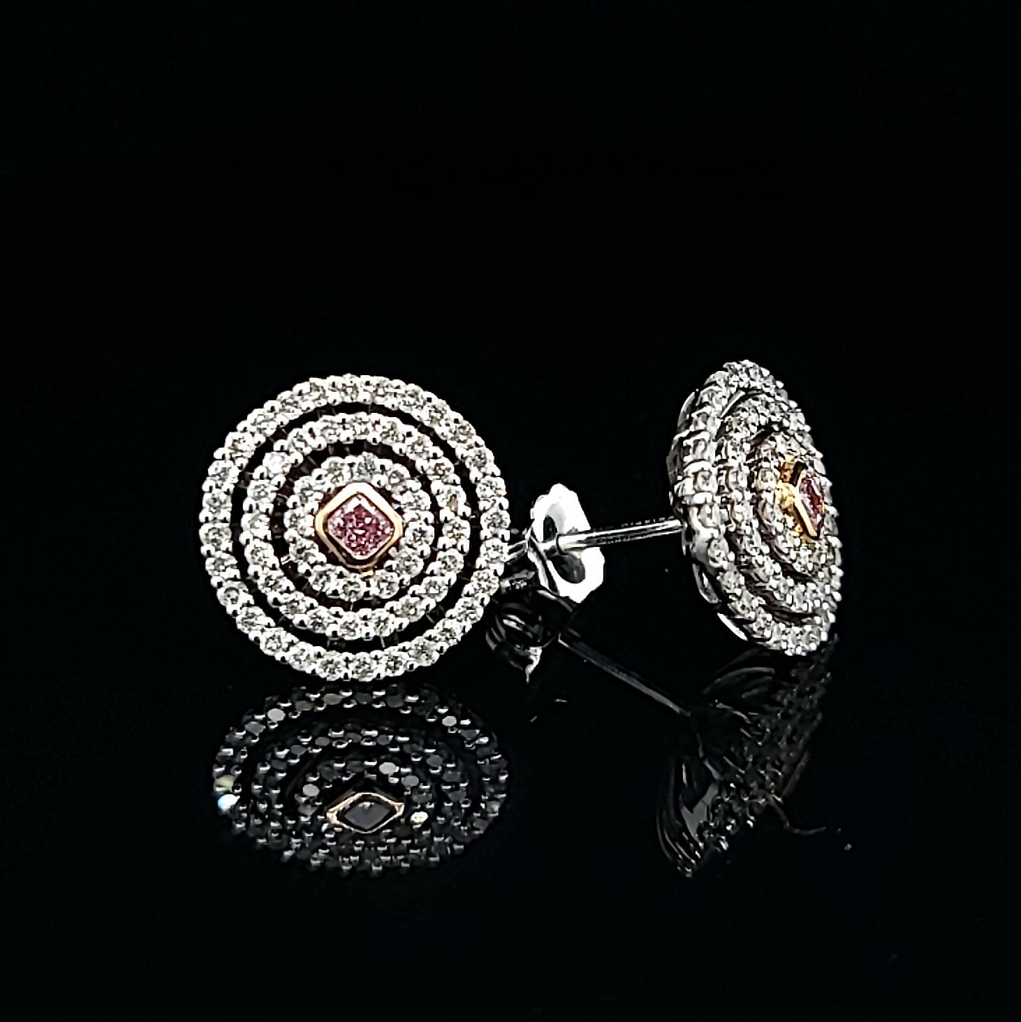 Pink Diamond 18k White Gold Rose Gold Stud Earrings by Kristin Hanson. Bath in the elegance of Pink Diamond Water Ring stud earrings. With natural pink diamond center stones set in 18k rose gold and surrounded by triple halo pave' diamonds. A