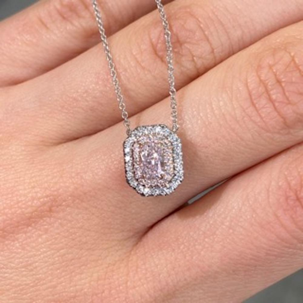 A delicate statement of elegance, this pendant features a captivating 0.50 carat Light Pink elongated radiant cut diamond. With VS2 clarity, the stone sparkles softly with natural brilliance, enhanced by a graceful setting of 14k rose gold and
